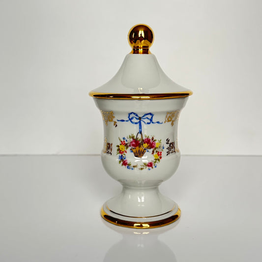 Vintage Limoges porcelain apothecary pharmacy jar with ribbon and floral basket decoration, France, 20th century.
