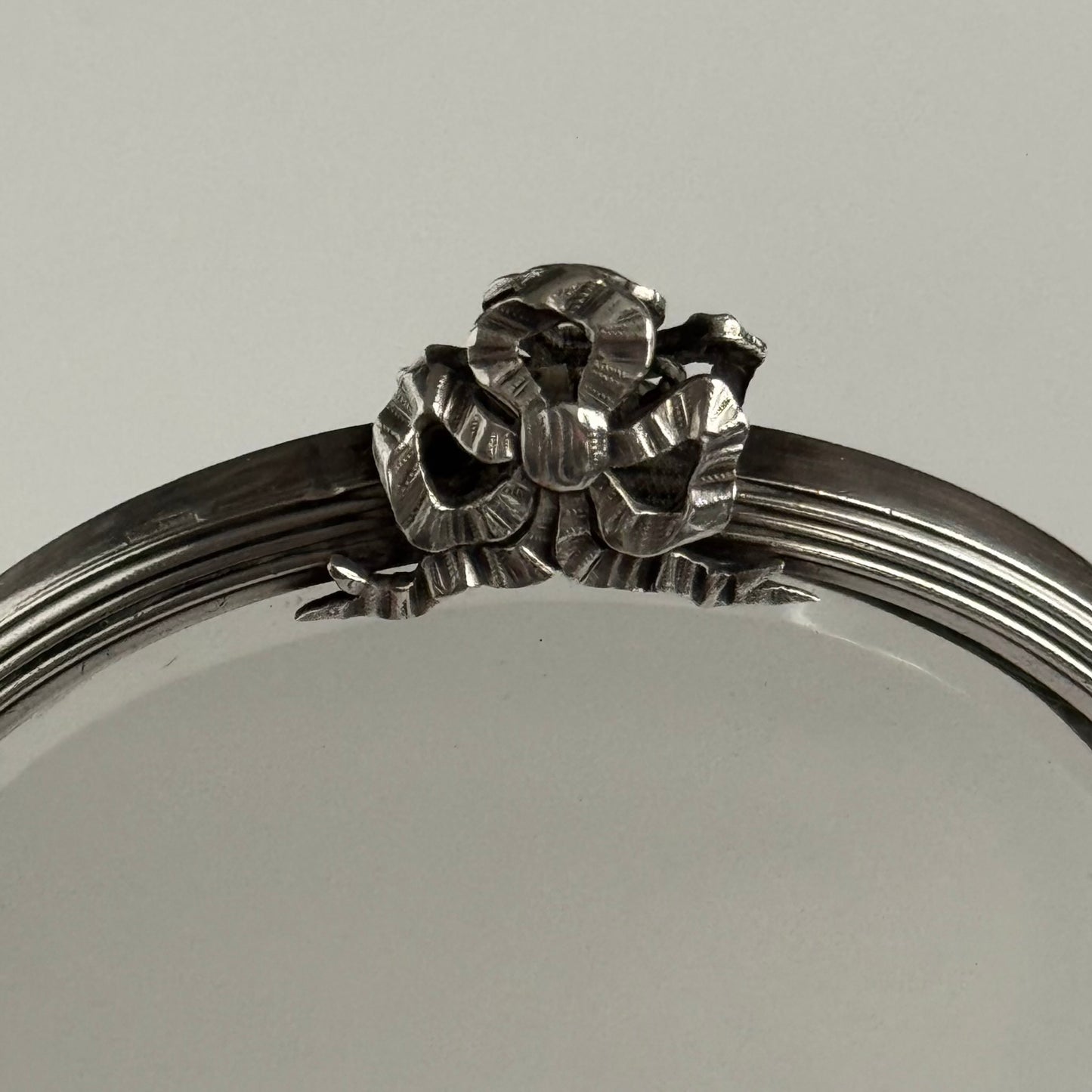 Silver Plate Hand Mirror | Louis XVI Style with Crossed Ribbons & Bow | Late 19th – Early 20th Century