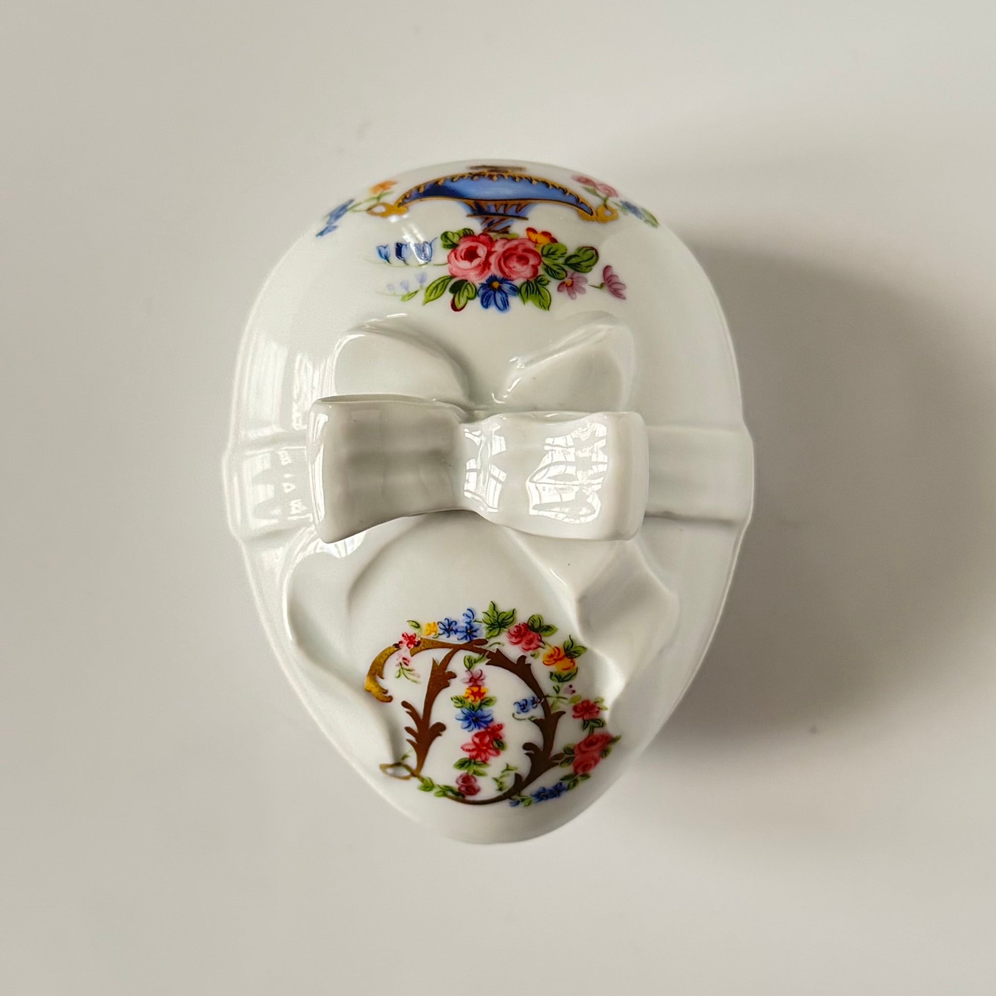 Vintage porcelain egg-shaped box by APILCO, inspired by the 18th-century Sèvres du Barry service. Features ribbon details, floral patterns, and “DB” initials in elegant design