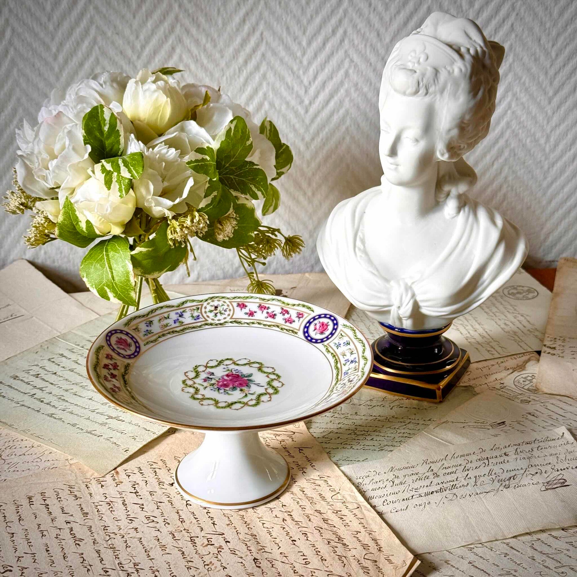 Haviland “Louveciennes” porcelain compote from Limoges, featuring delicate floral and botanical motifs inspired by the 1781 Sèvres service commissioned for Marie-Antoinette.