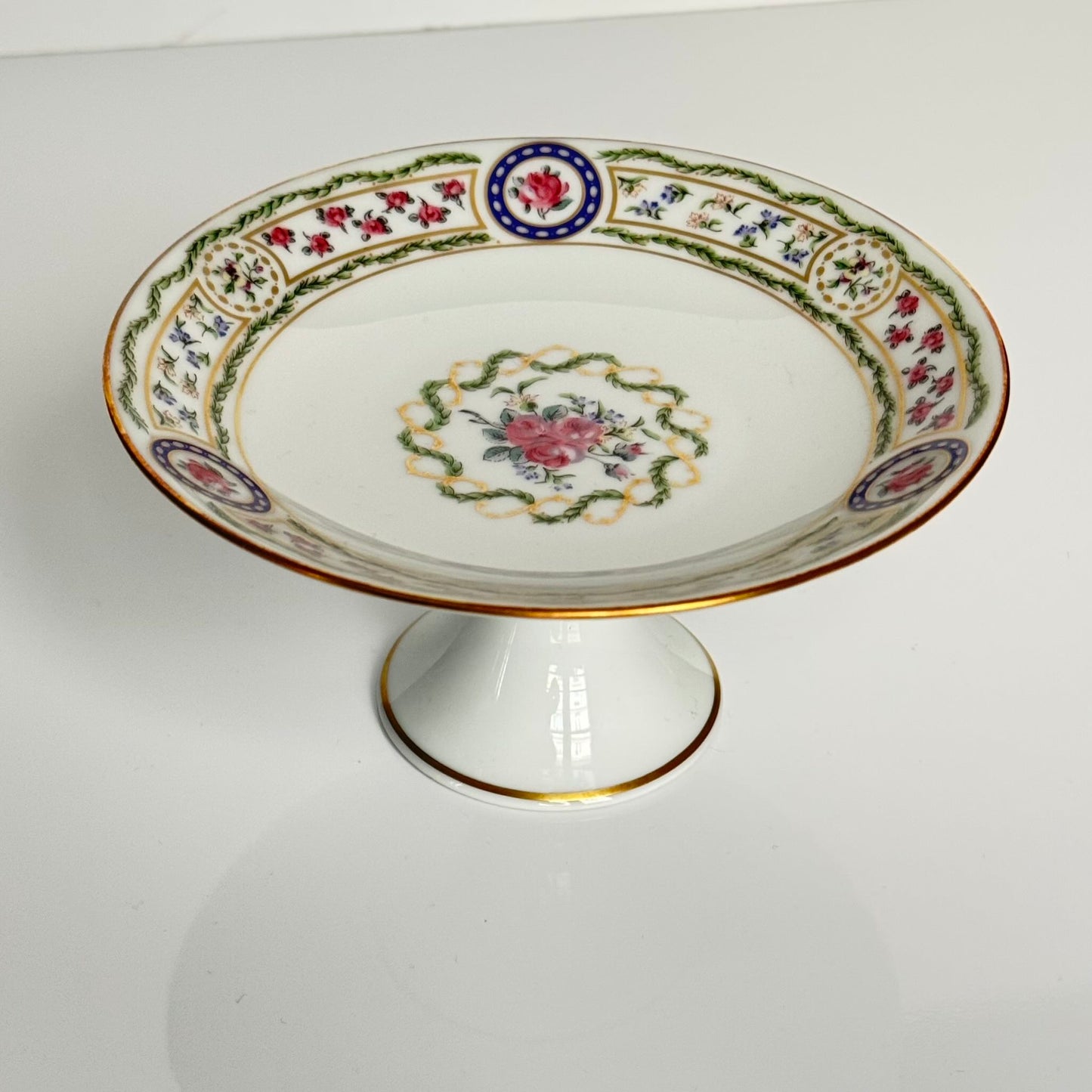 Haviland “Louveciennes” porcelain compote from Limoges, featuring delicate floral and botanical motifs inspired by the 1781 Sèvres service commissioned for Marie-Antoinette.