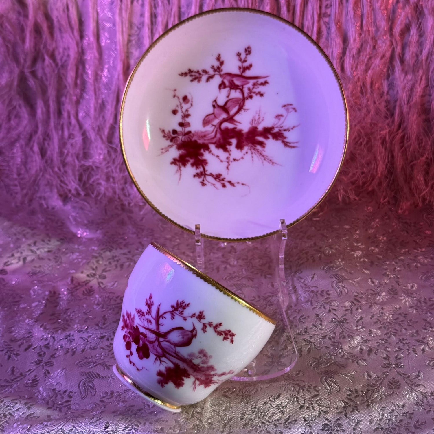Mid-18th century (circa 1757) Sèvres Hébert cup & saucer with bird motif in soft purple camaieu. Features delicate gold-edged detailing.