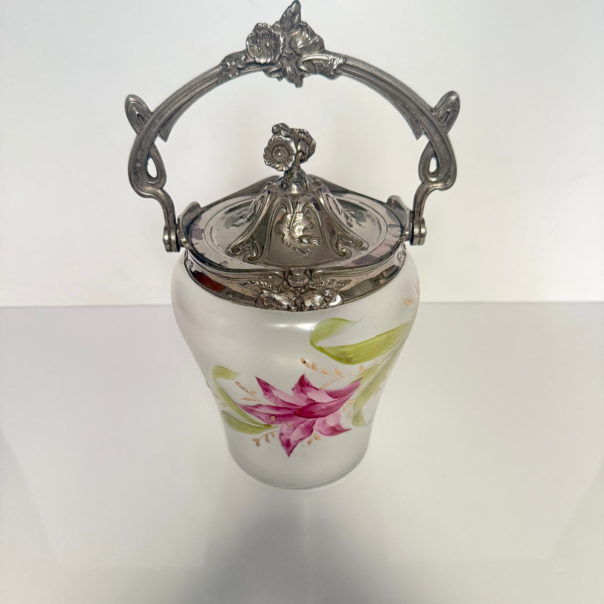 Antique Art Nouveau frosted glass biscuit barrel, decorated with a hand-painted pink flower and ornate metal mount, France.