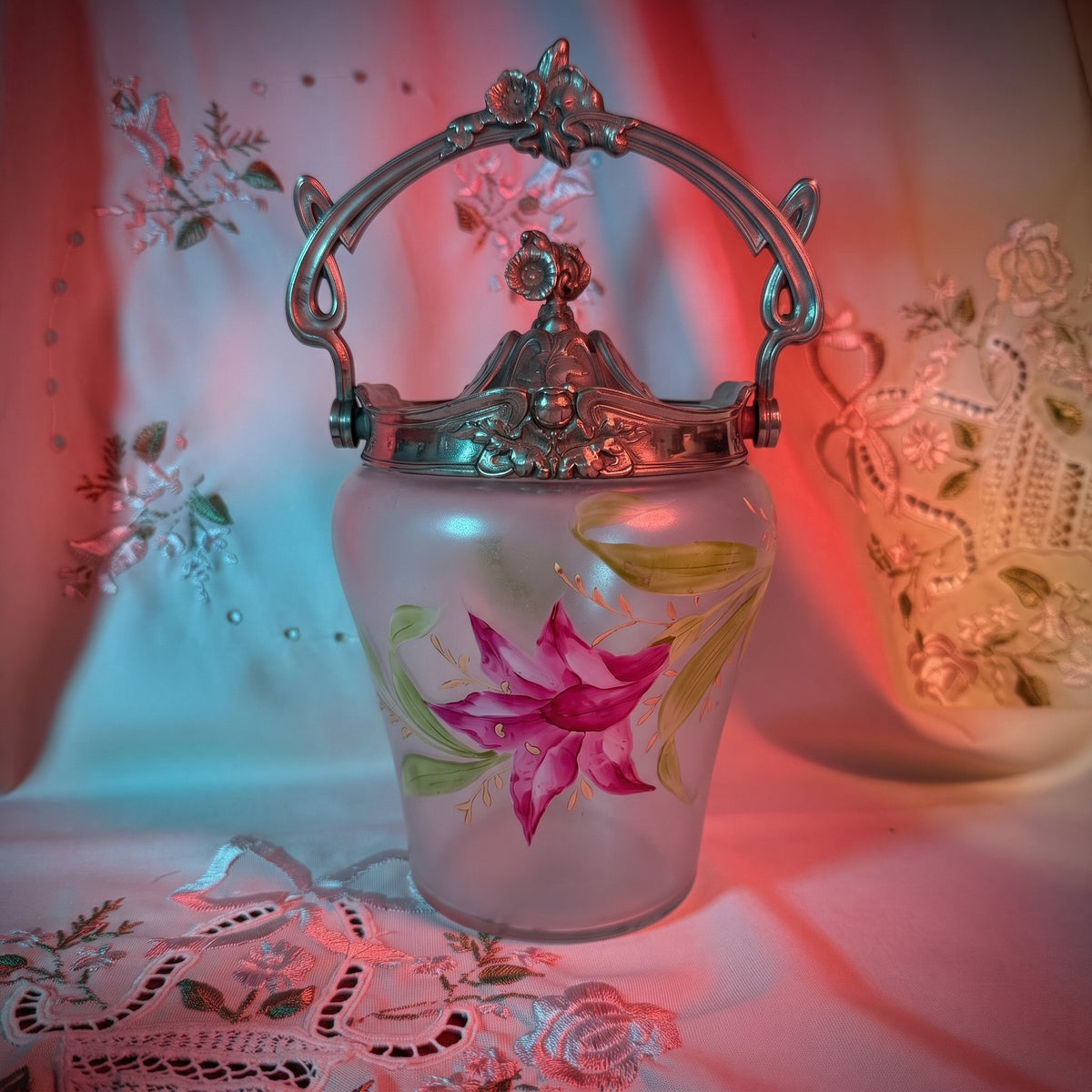Antique Art Nouveau frosted glass biscuit barrel, decorated with a hand-painted pink flower and ornate metal mount, France.