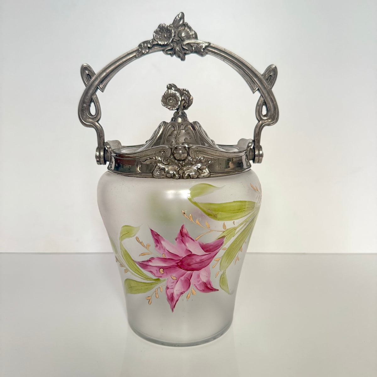 Antique Art Nouveau frosted glass biscuit barrel, decorated with a hand-painted pink flower and ornate metal mount, France.