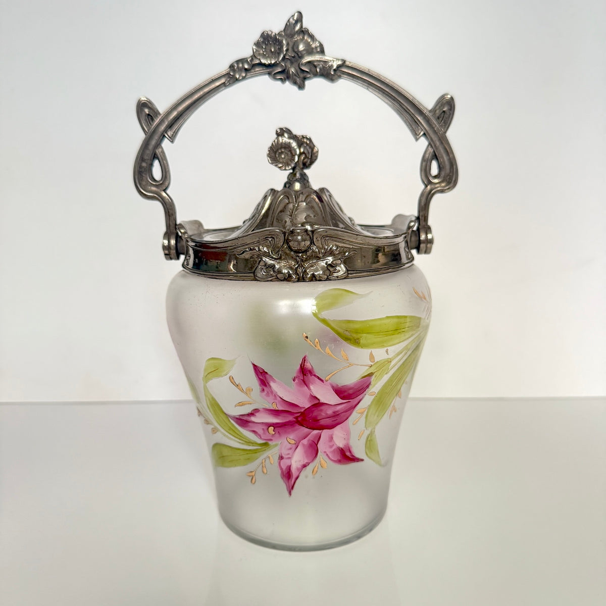 Antique Art Nouveau frosted glass biscuit barrel, decorated with a hand-painted pink flower and ornate metal mount, France.