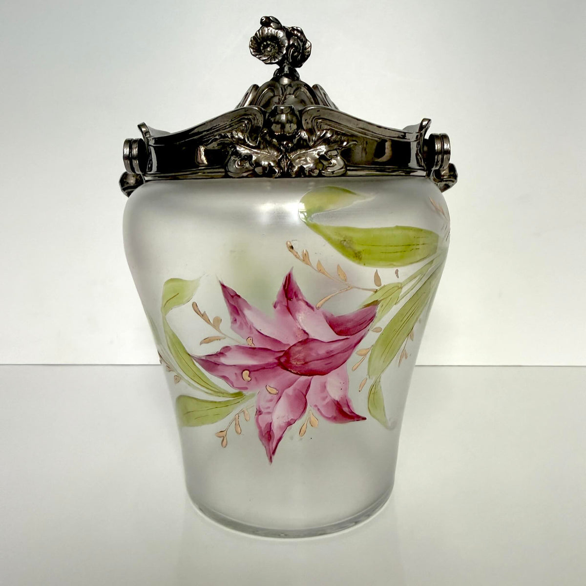 Antique Art Nouveau frosted glass biscuit barrel, decorated with a hand-painted pink flower and ornate metal mount, France.