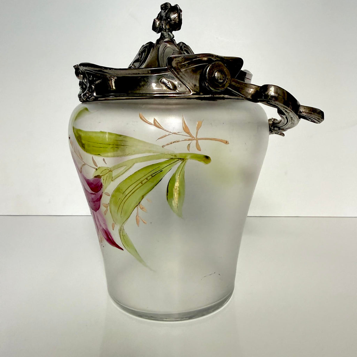 Antique Art Nouveau frosted glass biscuit barrel, decorated with a hand-painted pink flower and ornate metal mount, France.