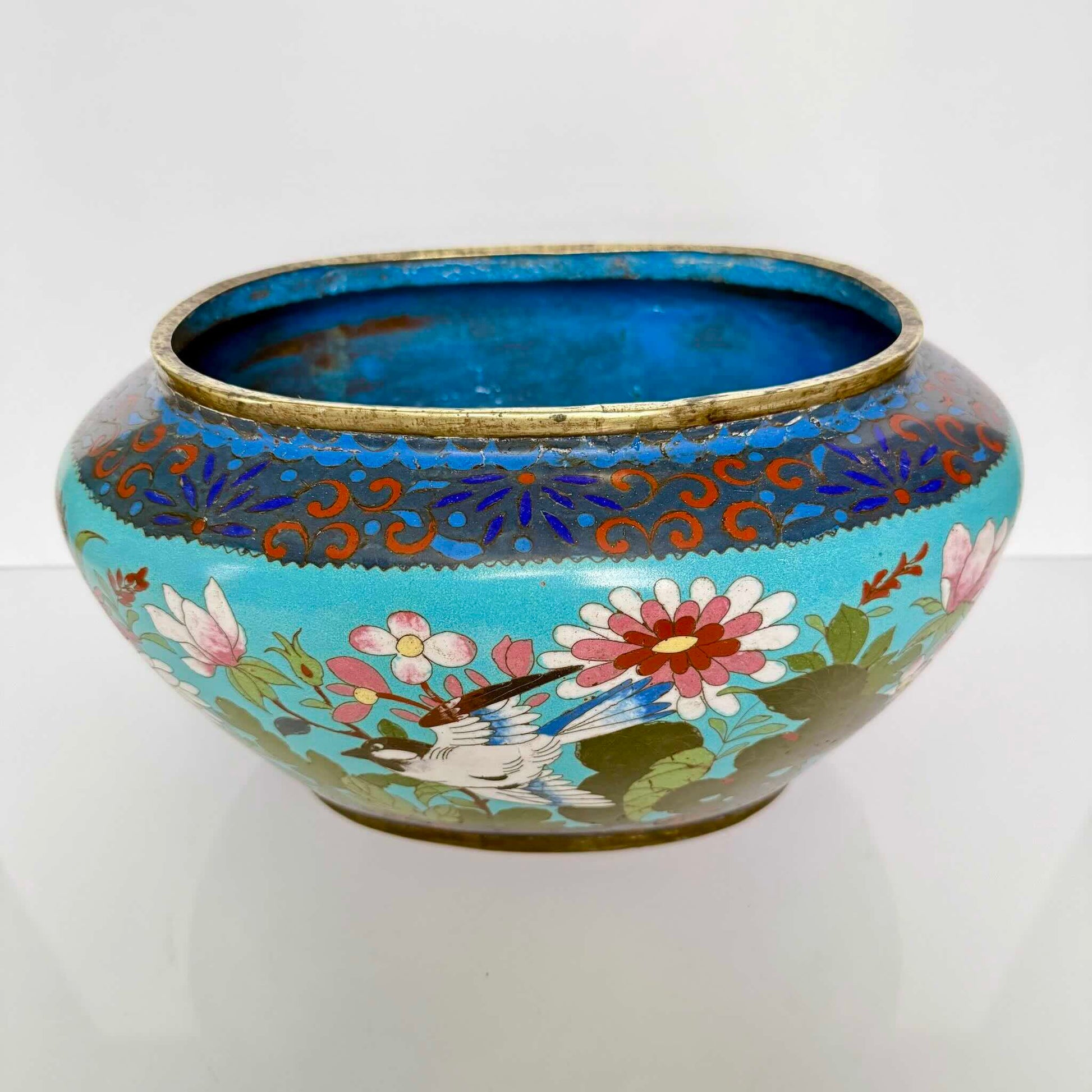 Antique Chinese cloisonné enamel jardinière, turquoise blue background with birds and butterflies, late 19th century.
