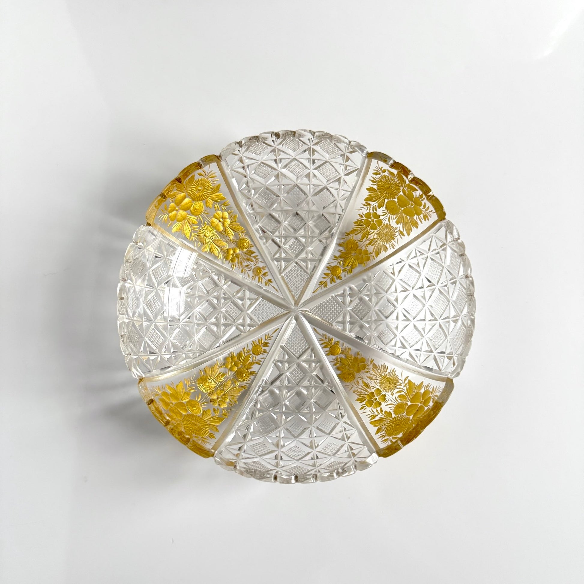 Antique French cut crystal bowl adorned with geometric patterns and gold-enhanced floral motifs, attributed to Baccarat or Saint-Louis.