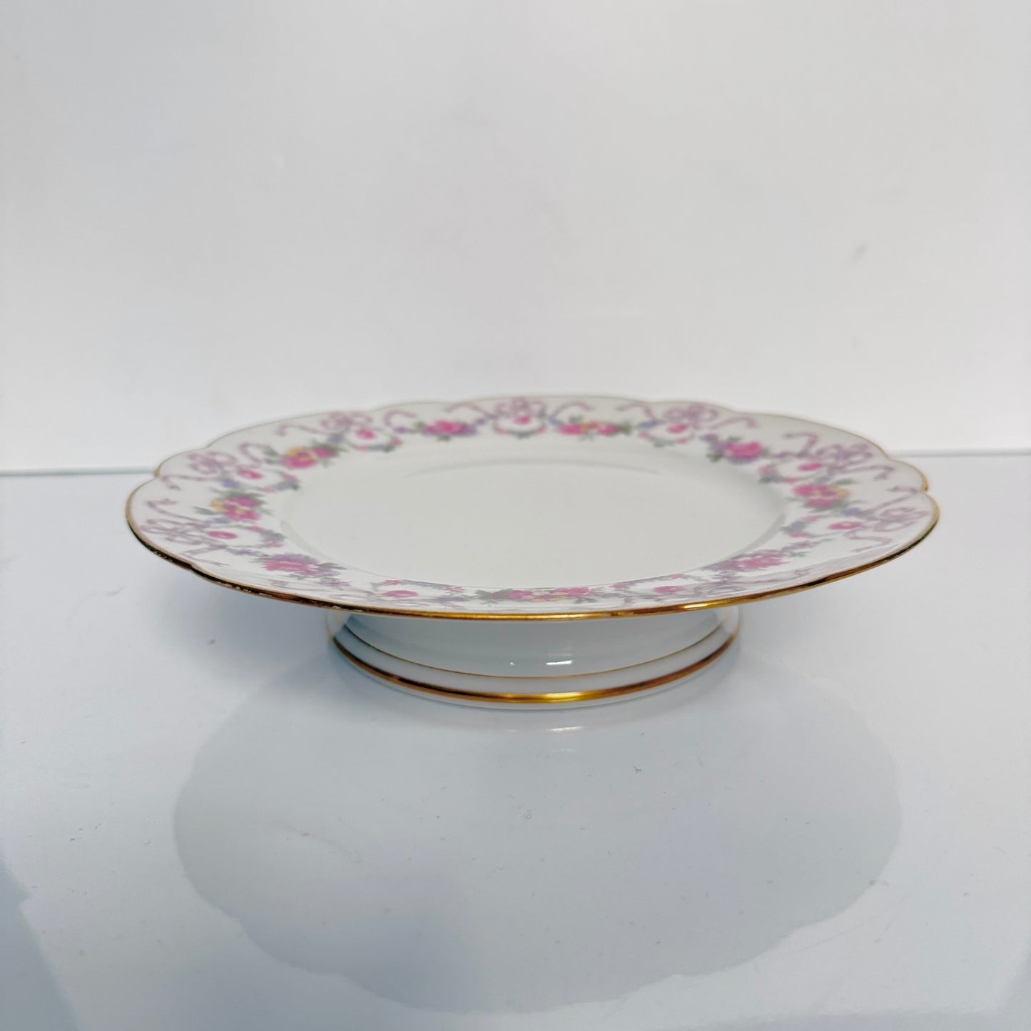 Antique Limoges porcelain footed cake stand, floral garlands and ribbons, D&C Old Bernardaud, late 19th century France.