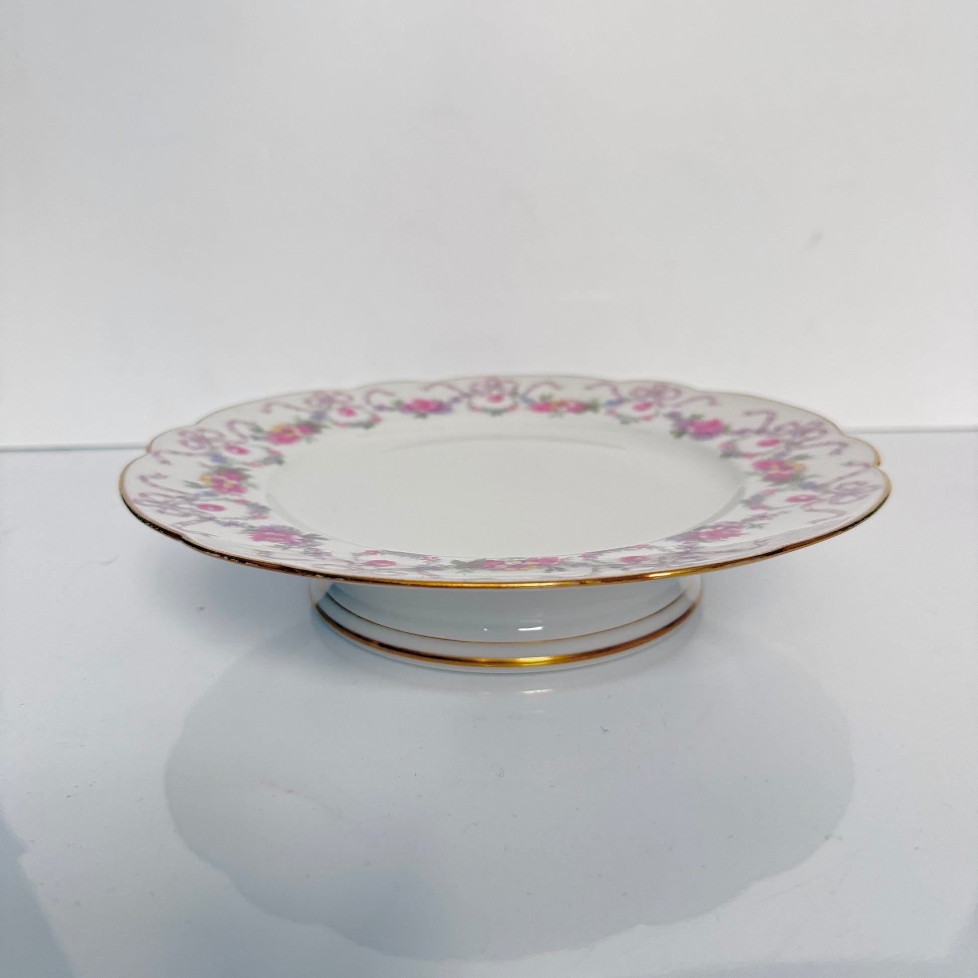 Antique Limoges porcelain footed cake stand, floral garlands and ribbons, D&C Old Bernardaud, late 19th century France.