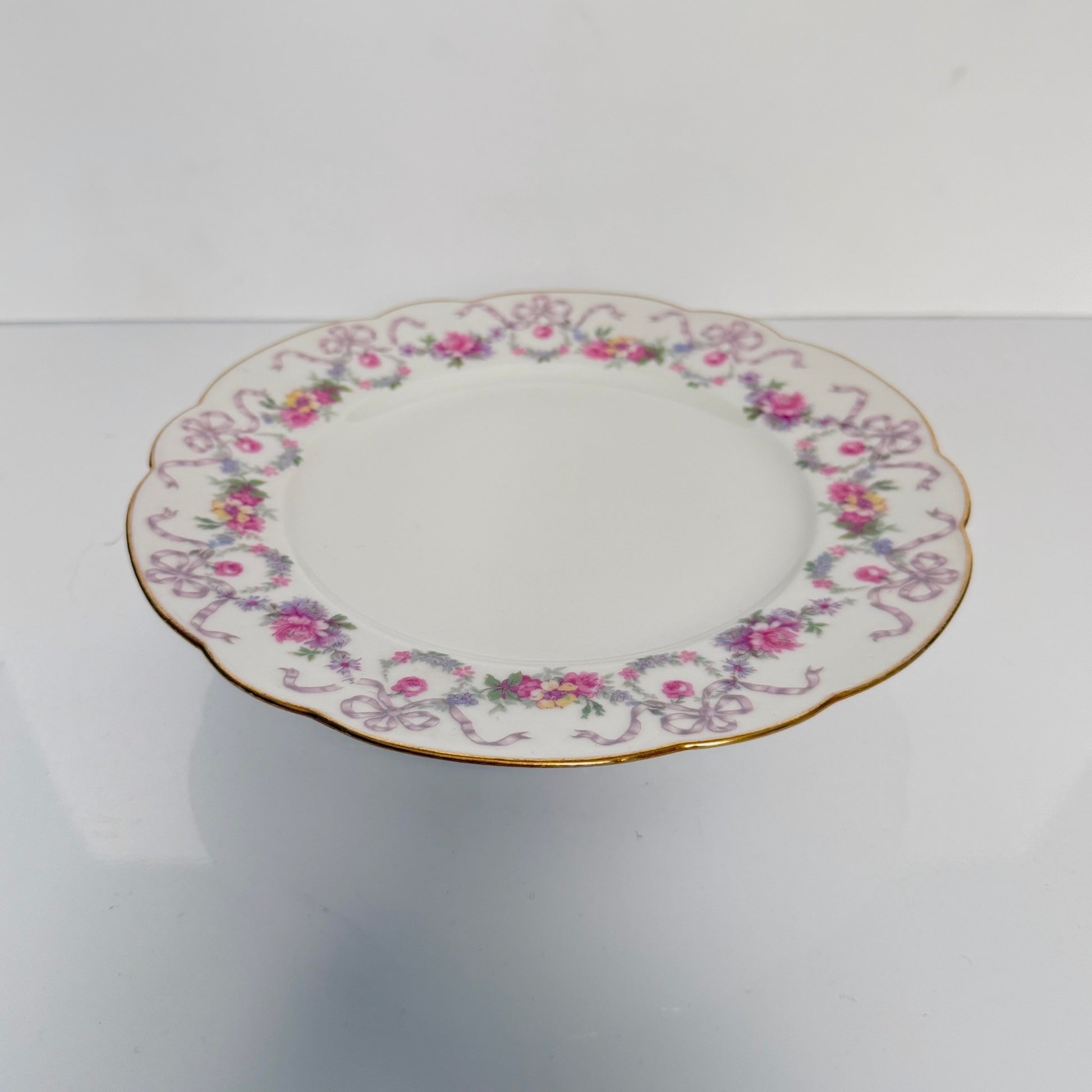 Antique Limoges porcelain footed cake stand, floral garlands and ribbons, D&C Old Bernardaud, late 19th century France.