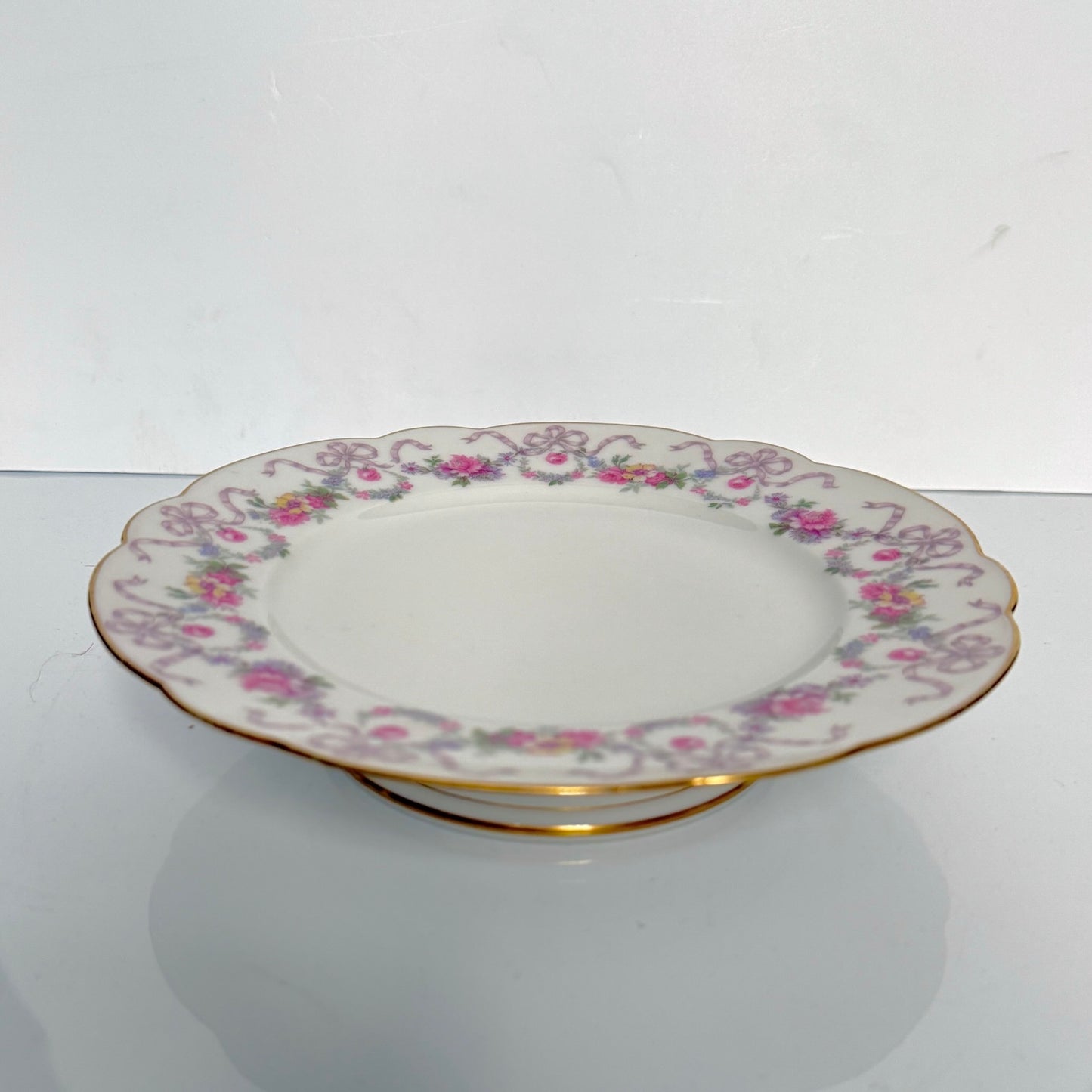 Antique Limoges porcelain footed cake stand, floral garlands and ribbons, D&C Old Bernardaud, late 19th century France.