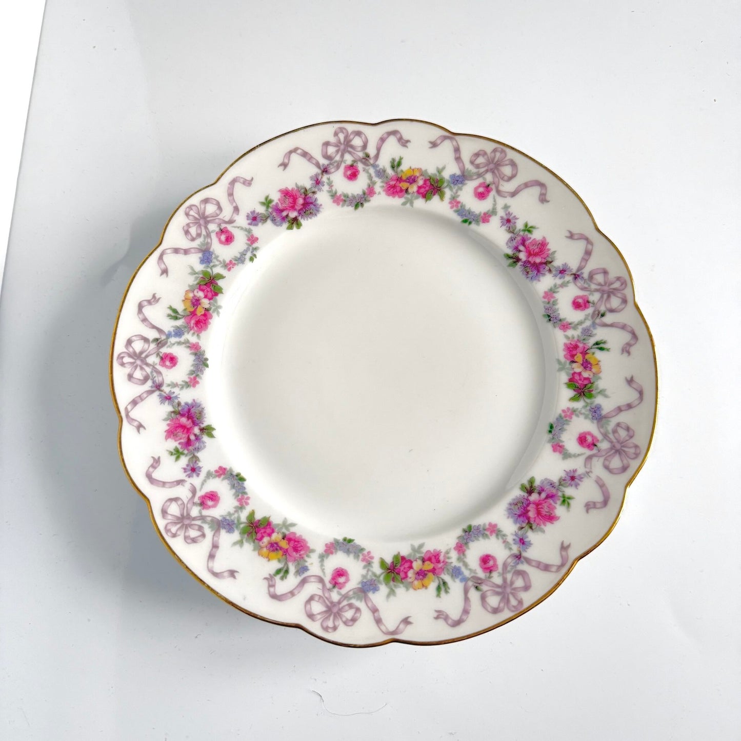 Antique Limoges porcelain footed cake stand, floral garlands and ribbons, D&C Old Bernardaud, late 19th century France.