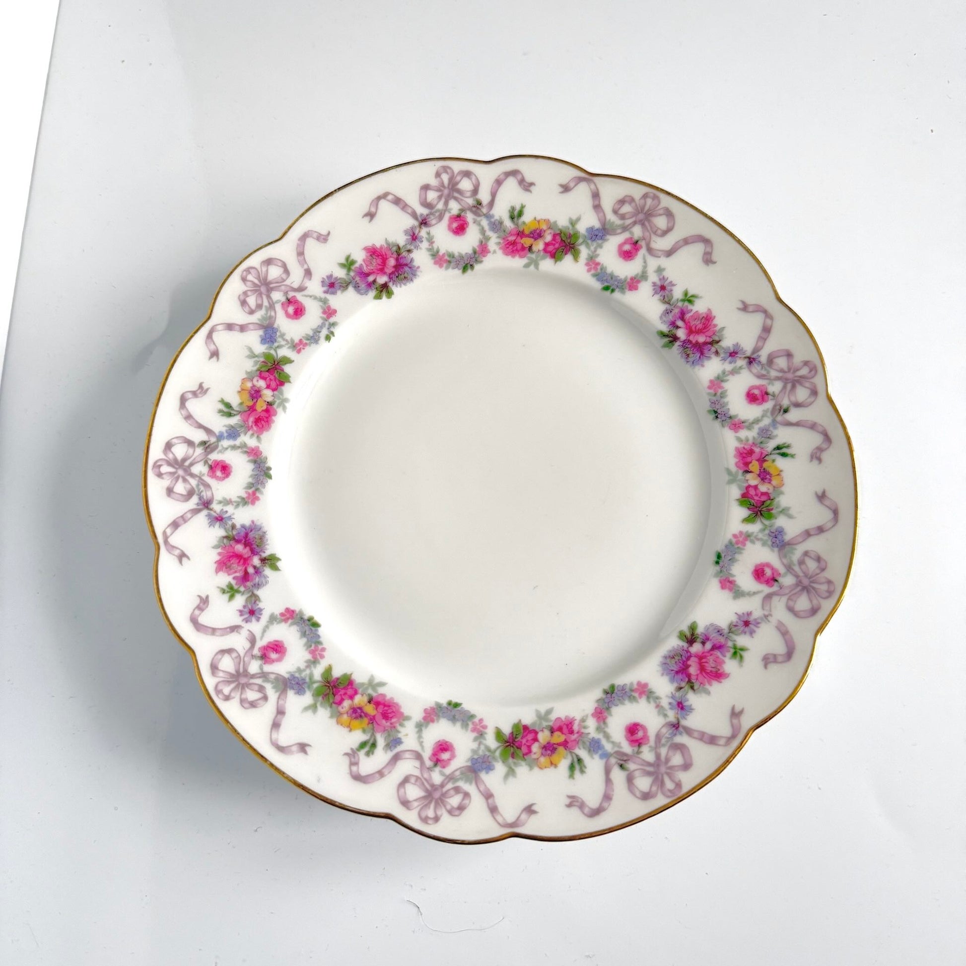 Antique Limoges porcelain footed cake stand, floral garlands and ribbons, D&C Old Bernardaud, late 19th century France.