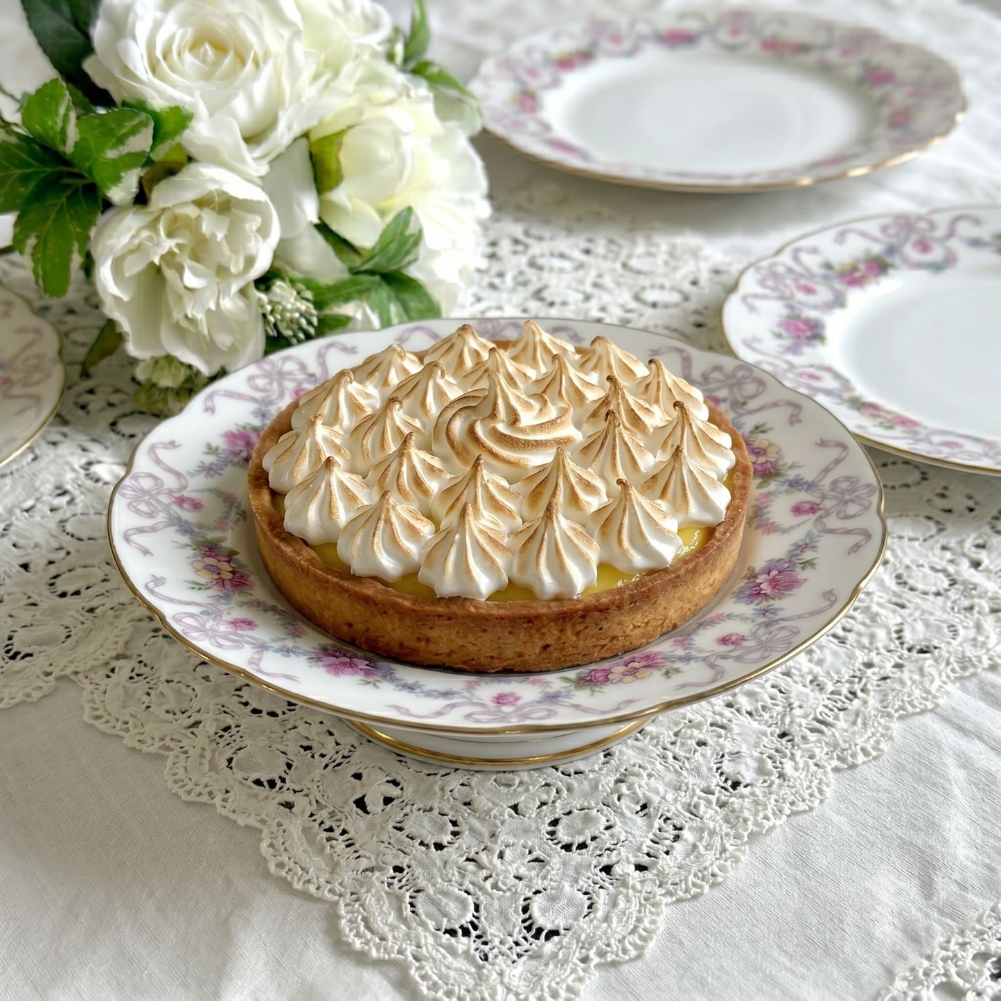 Antique Limoges porcelain footed cake stand, floral garlands and ribbons, D&C Old Bernardaud, late 19th century France.