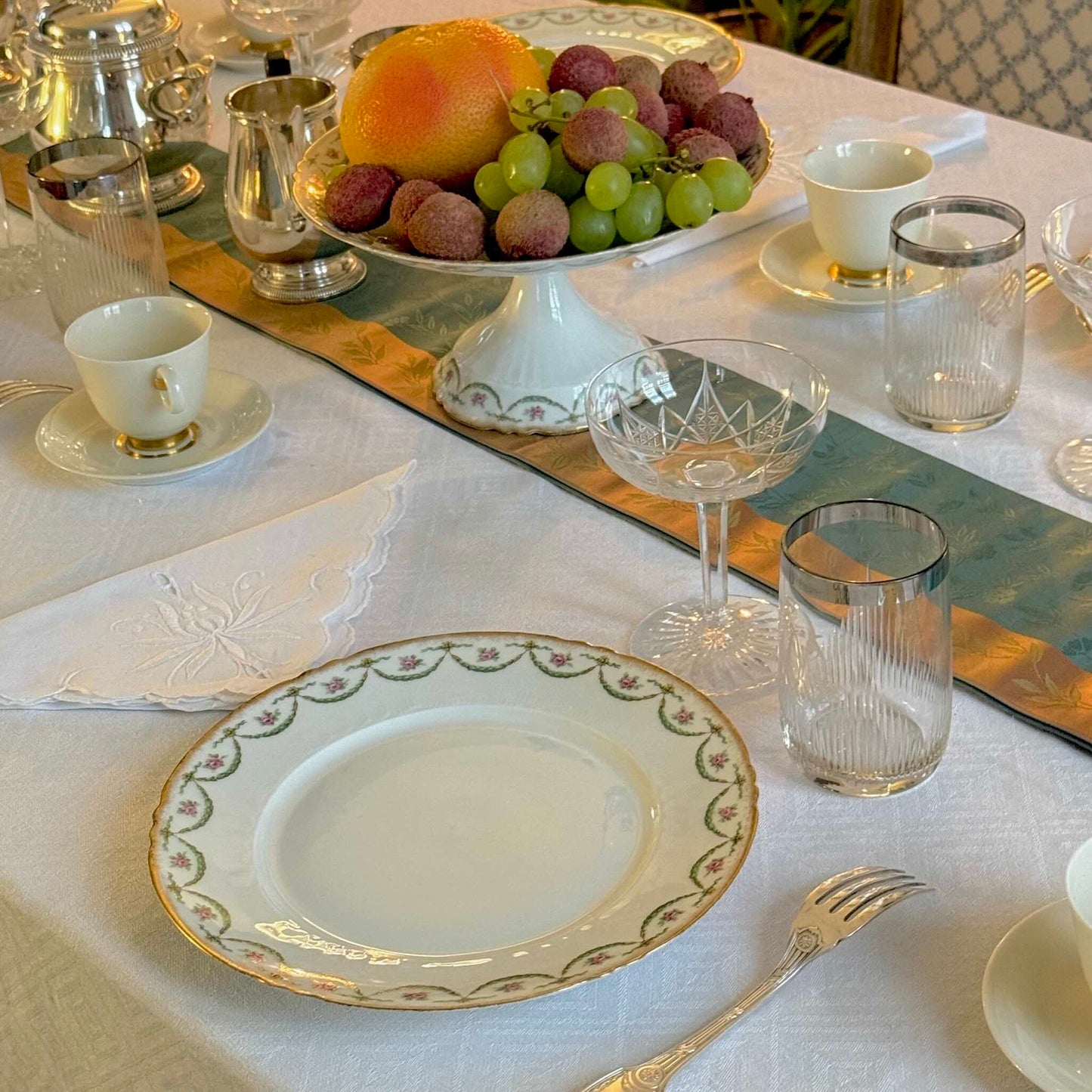 Antique Limoges porcelain dessert plate with pink rose floral pattern and gold trim, late 19th or early 20th century France.