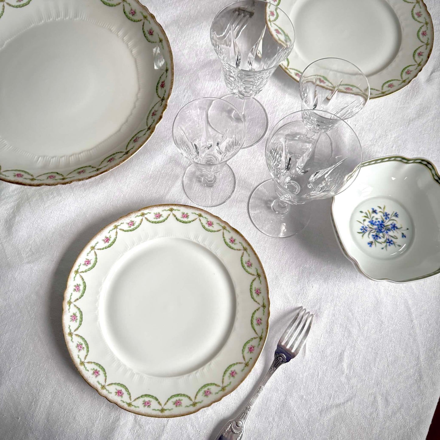 Antique Limoges porcelain dessert plate with pink rose floral pattern and gold trim, late 19th or early 20th century France.