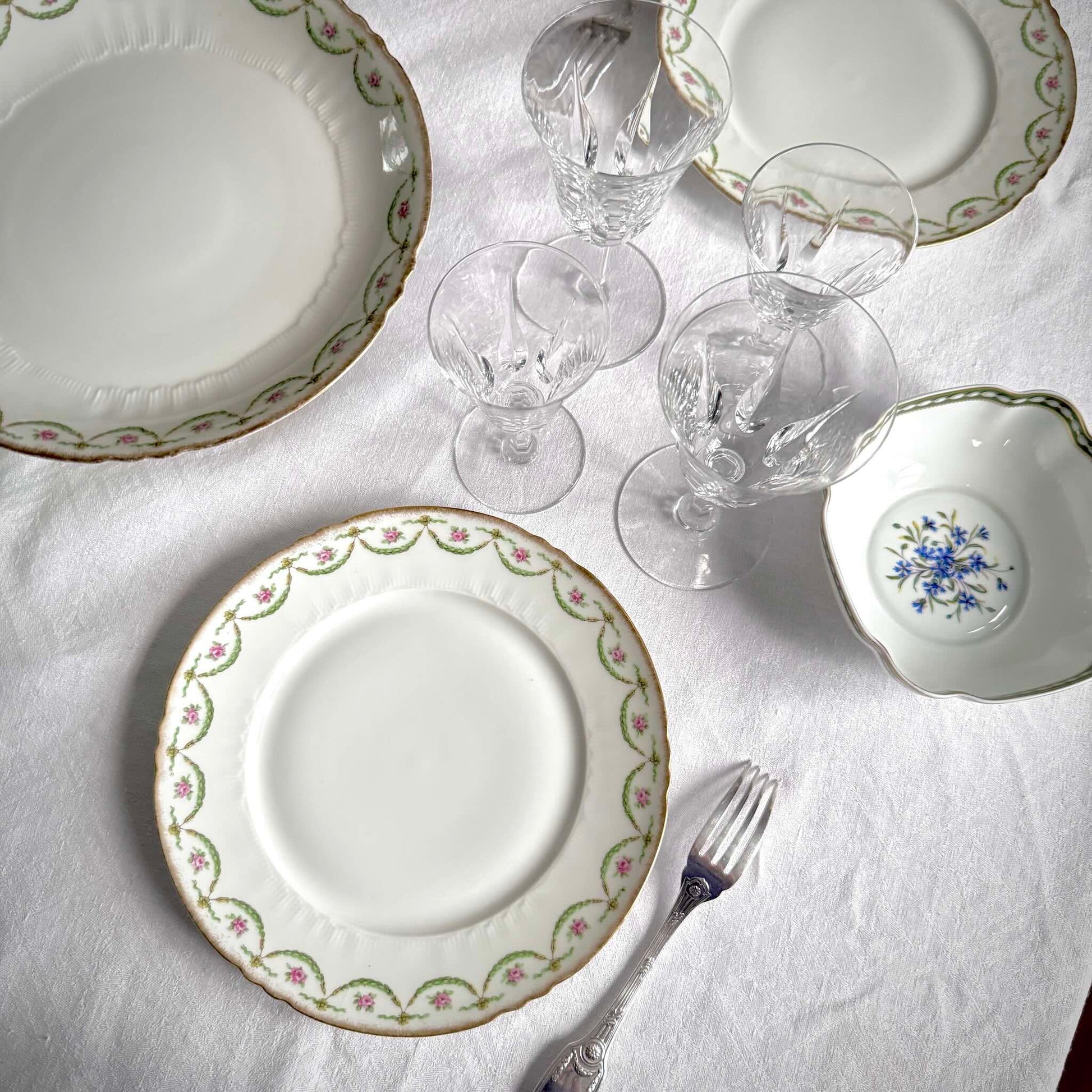 Antique Limoges porcelain dessert plate with pink rose floral pattern and gold trim, late 19th or early 20th century France.