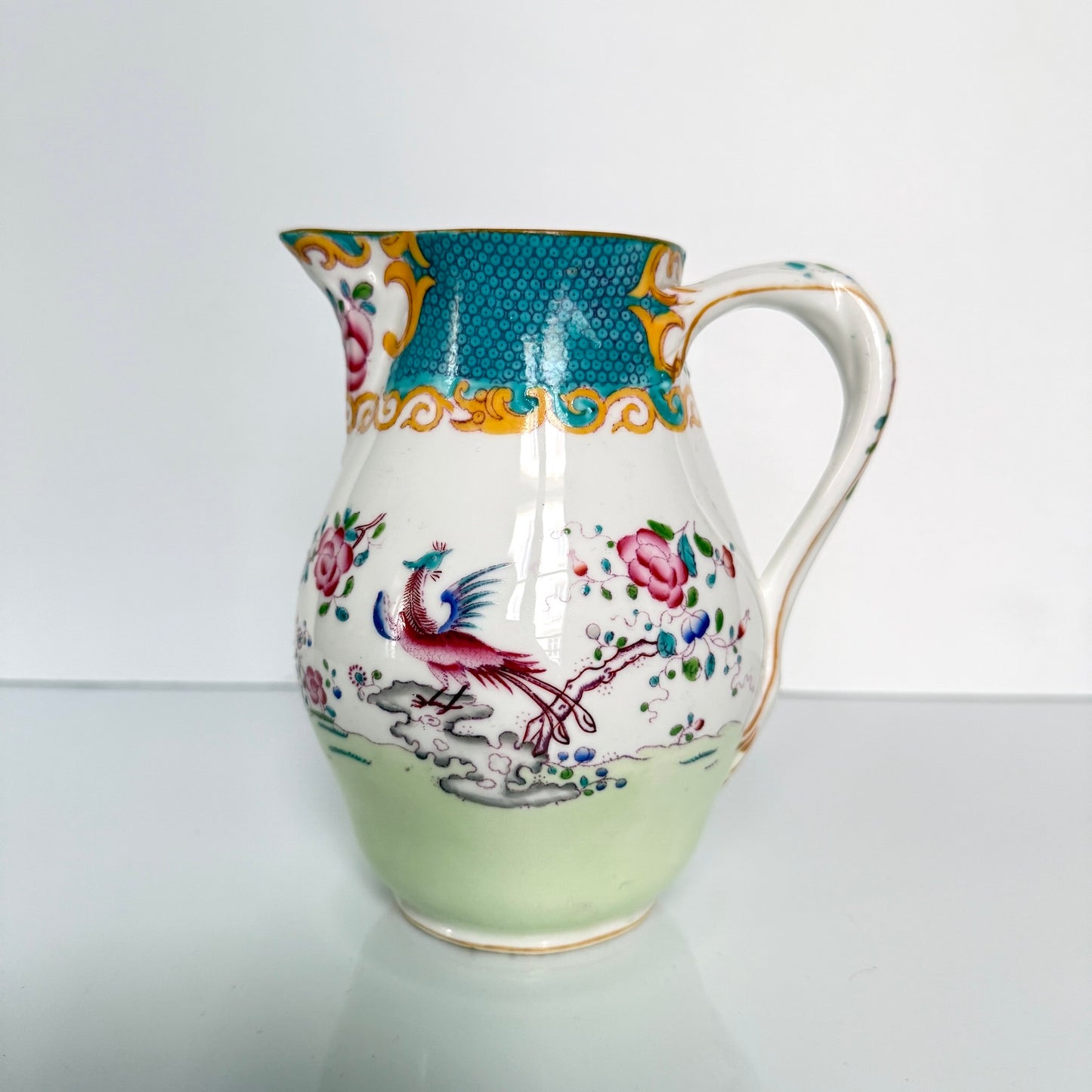 Antique Minton porcelain milk jug, chinoiserie decoration with phoenix and flowers, circa 1880-1890 England.