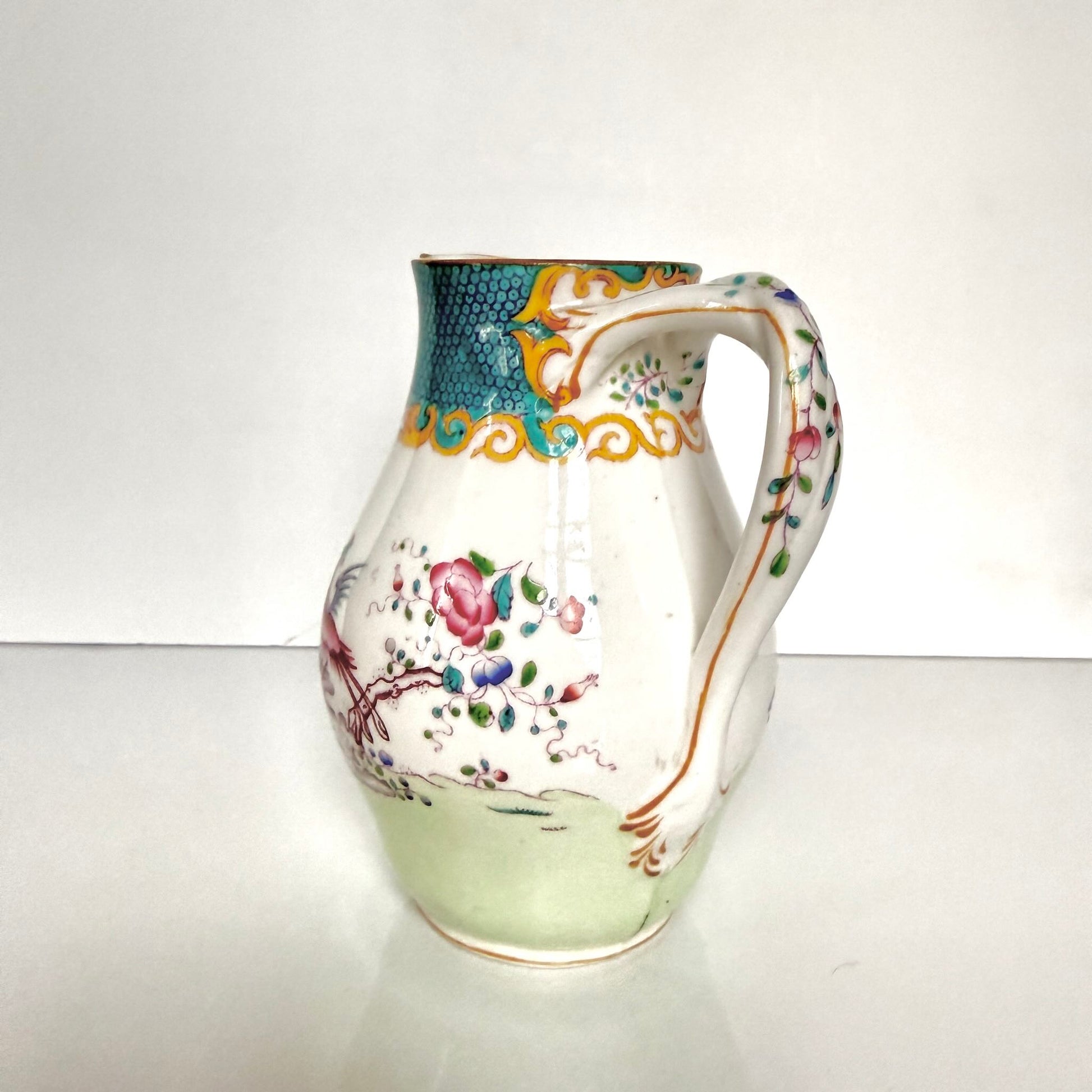 Antique Minton porcelain milk jug, chinoiserie decoration with phoenix and flowers, circa 1880-1890 England.