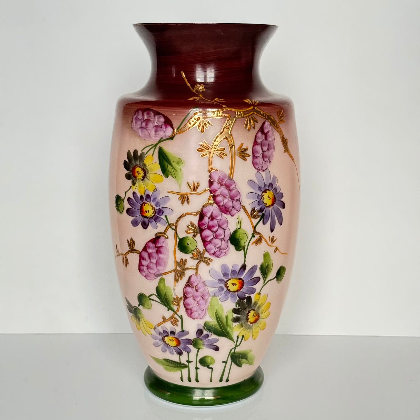 Pair of antique French opaline glass vases with pink and plum gradient, adorned with hand-painted floral motifs and thick gold enamel, 19th century.