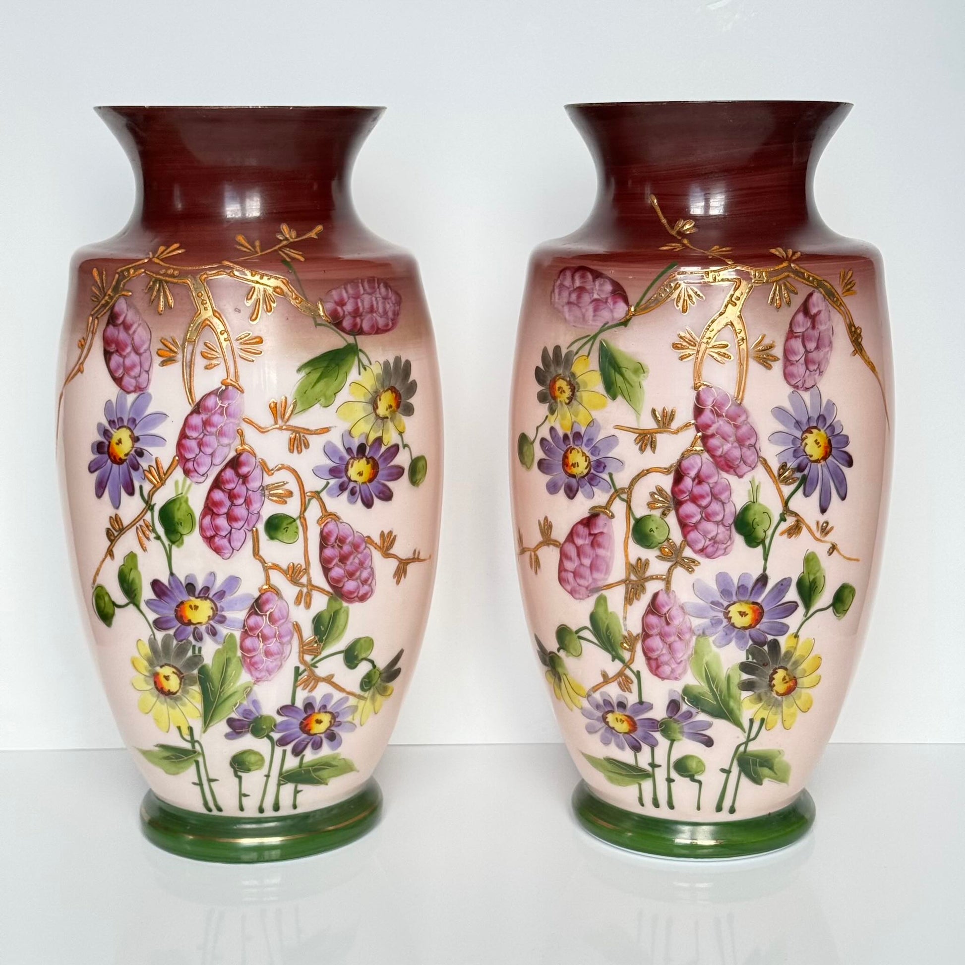 Pair of antique French opaline glass vases with pink and plum gradient, adorned with hand-painted floral motifs and thick gold enamel, 19th century.