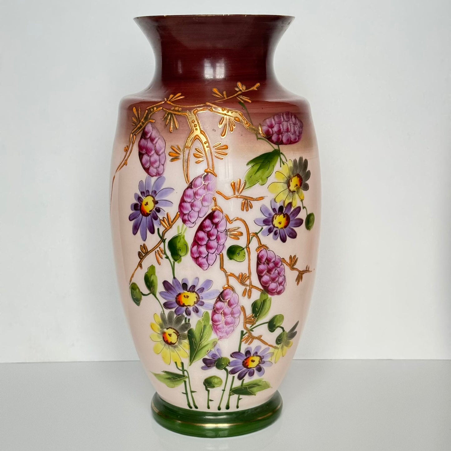 Pair of antique French opaline glass vases with pink and plum gradient, adorned with hand-painted floral motifs and thick gold enamel, 19th century.