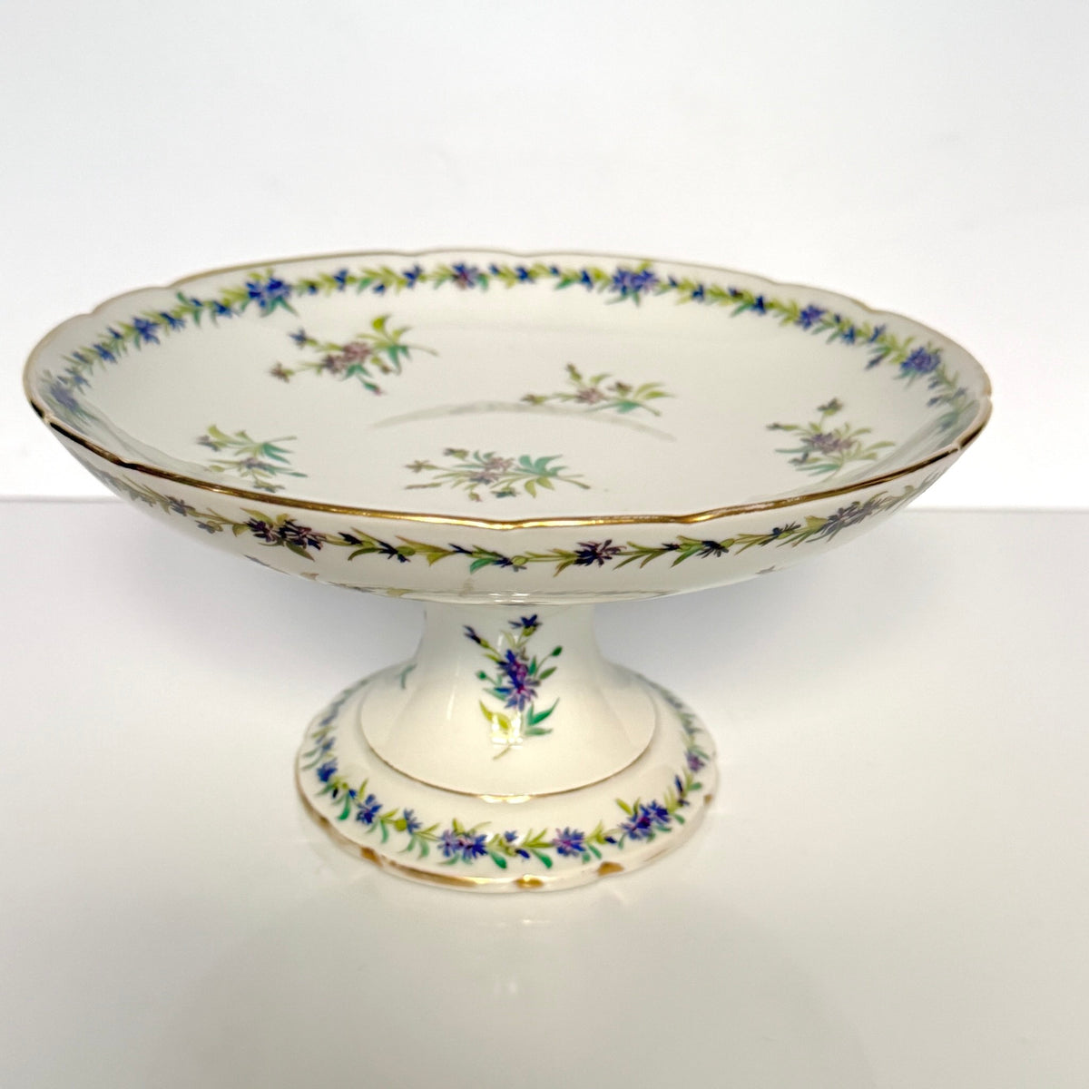 Antique Vieux Paris porcelain pedestal compote, hand-painted with blue cornflowers and gold trim, 19th century France.