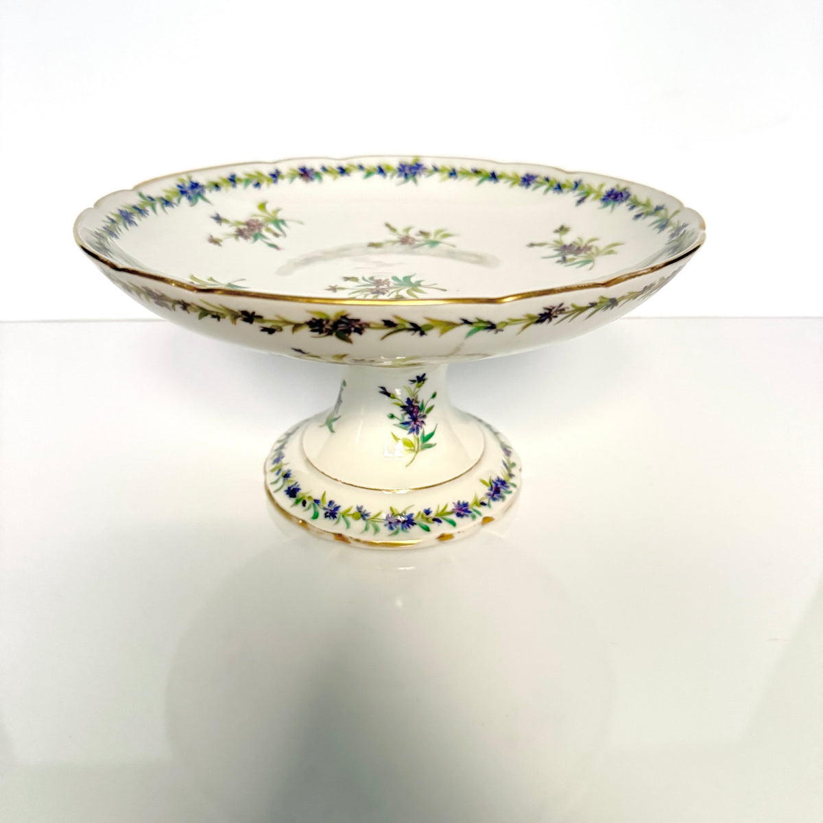 Antique Vieux Paris porcelain pedestal compote, hand-painted with blue cornflowers and gold trim, 19th century France.
