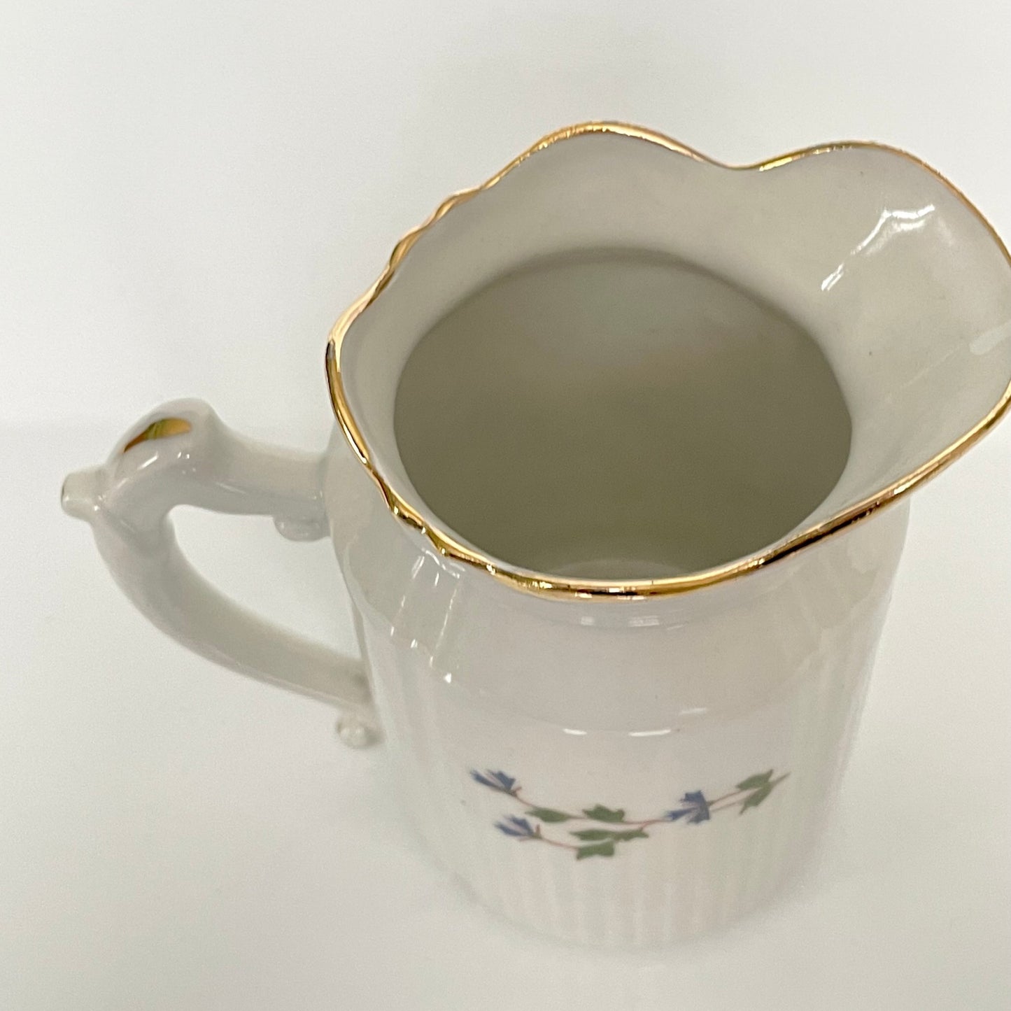 Charming creamer featuring a beautiful cornflower motif, inspired by the designs favored by 18th-century French nobility. Known to have been used in Sèvres porcelain tableware owned by Marie Antoinette.