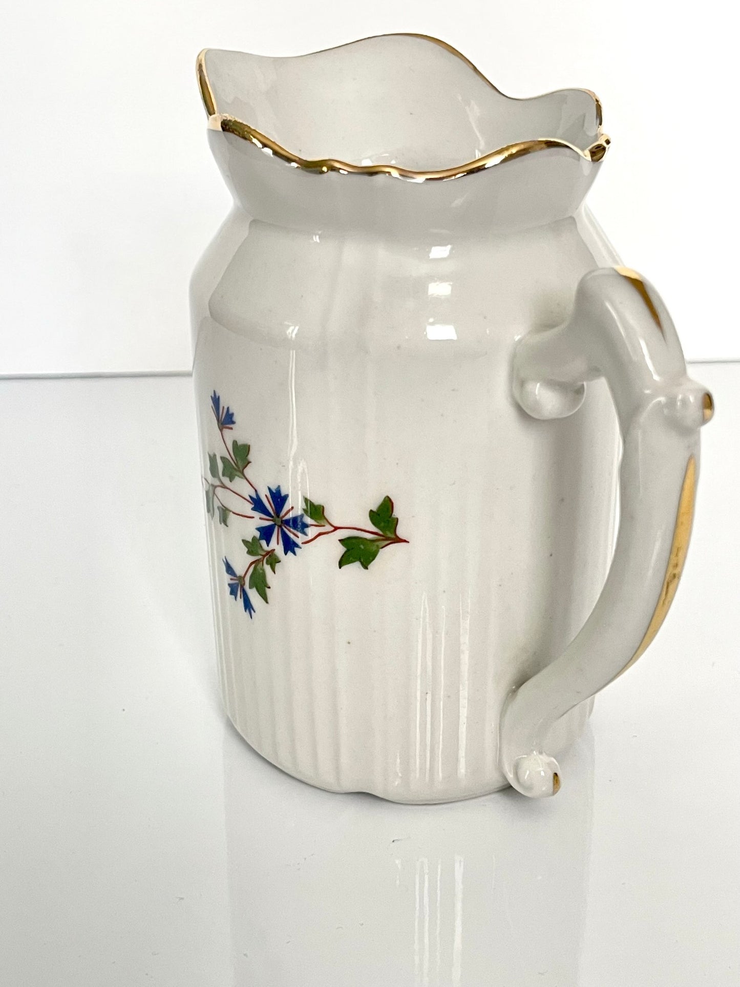 Charming creamer featuring a beautiful cornflower motif, inspired by the designs favored by 18th-century French nobility. Known to have been used in Sèvres porcelain tableware owned by Marie Antoinette.