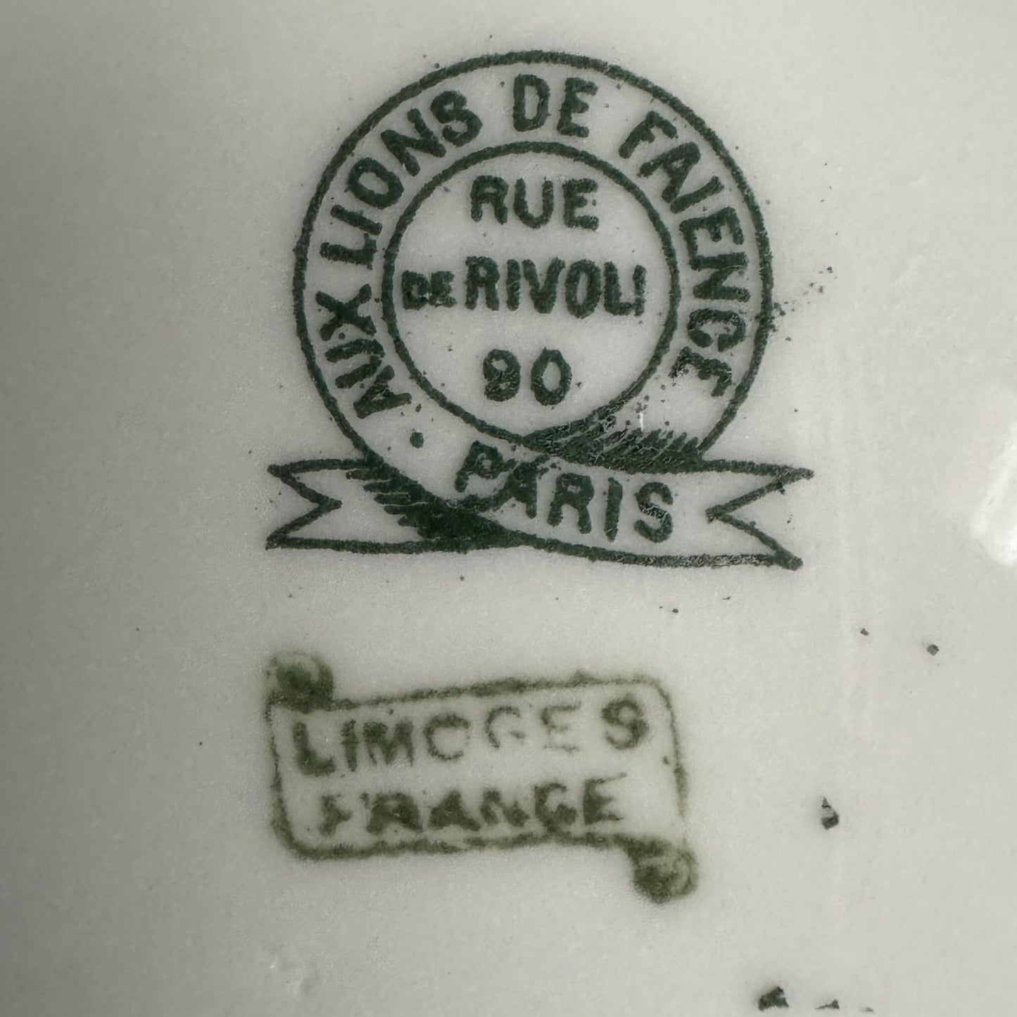 Limoges porcelain tea/coffee pot and sugar pot set with a floral and ribbon design, exuding elegance.