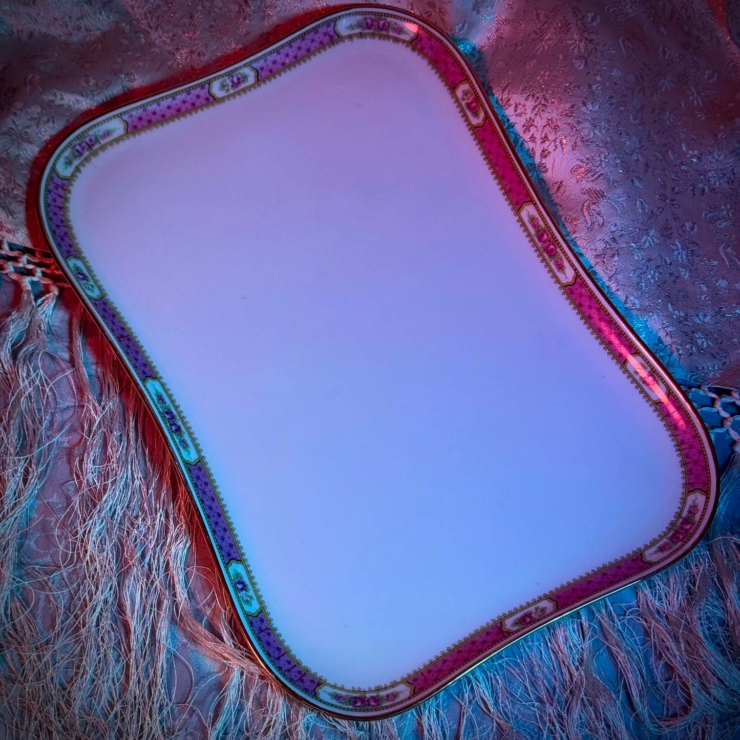 This is a Limoges porcelain tray with a delicate floral rose design and a soft pink border, perfect for tea or coffee service. It is signed by F. Paulhat Limoges, France.