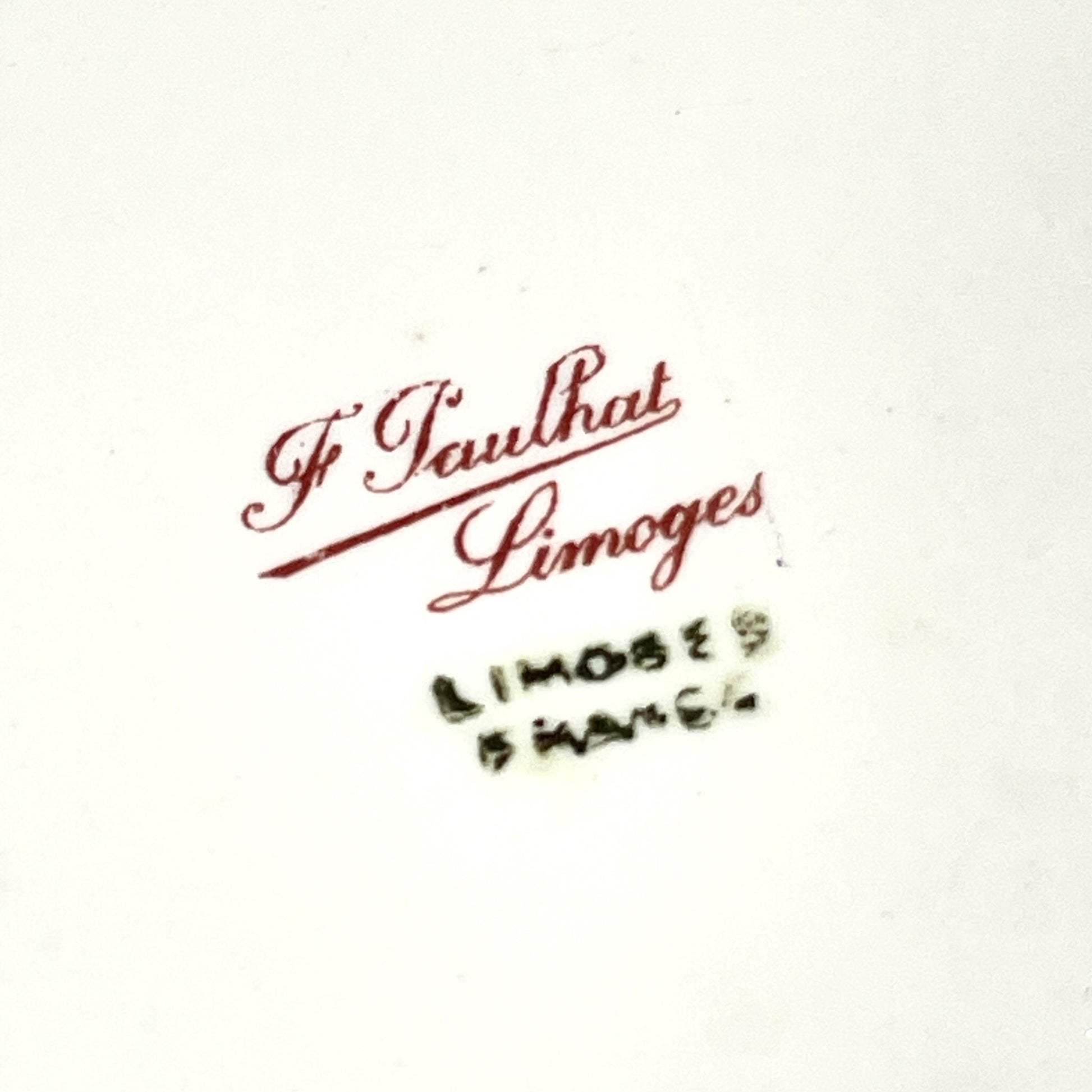 This is a Limoges porcelain tray with a delicate floral rose design and a soft pink border, perfect for tea or coffee service. It is signed by F. Paulhat Limoges, France.