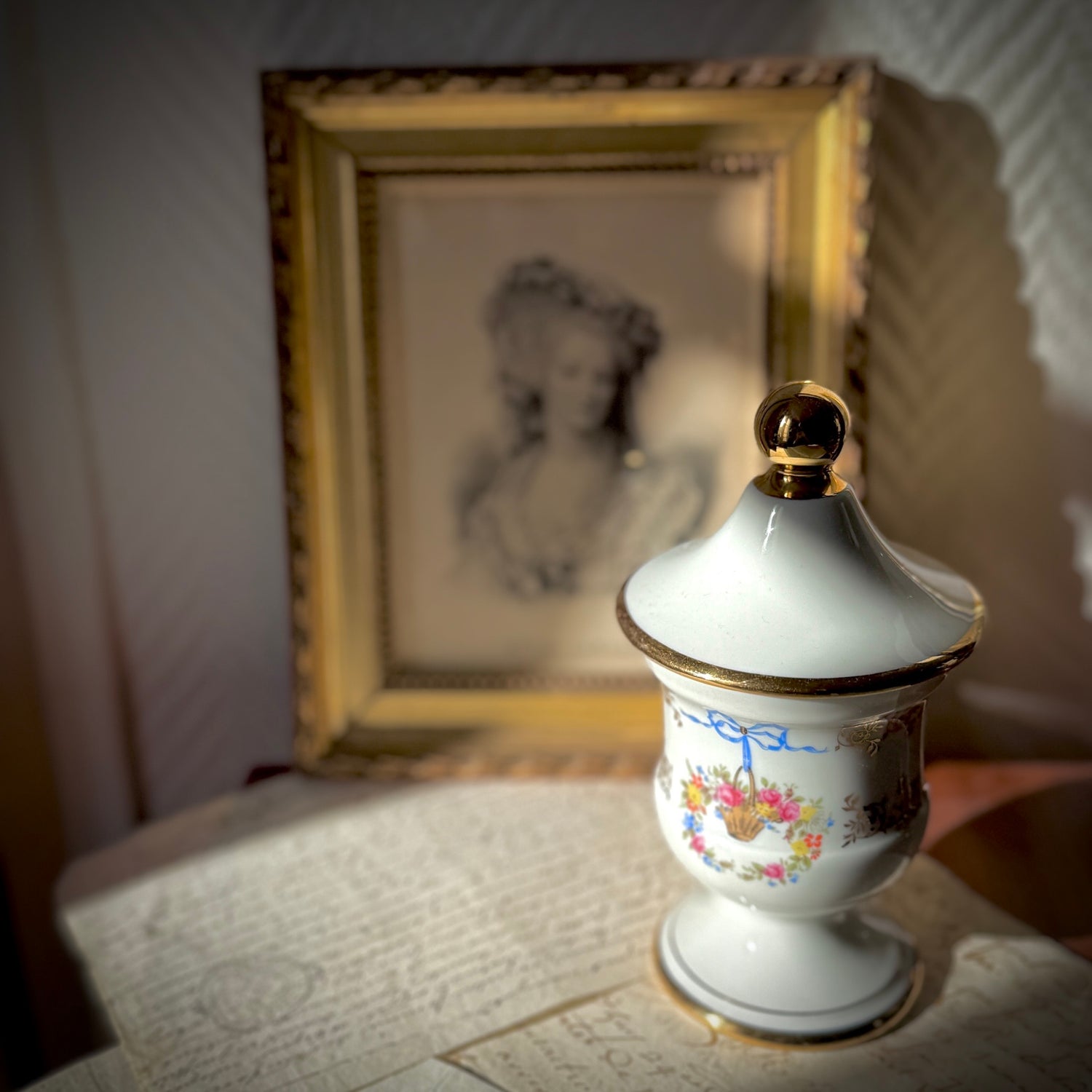 Vintage Limoges porcelain apothecary pharmacy jar with ribbon and floral basket decoration, France, 20th century.