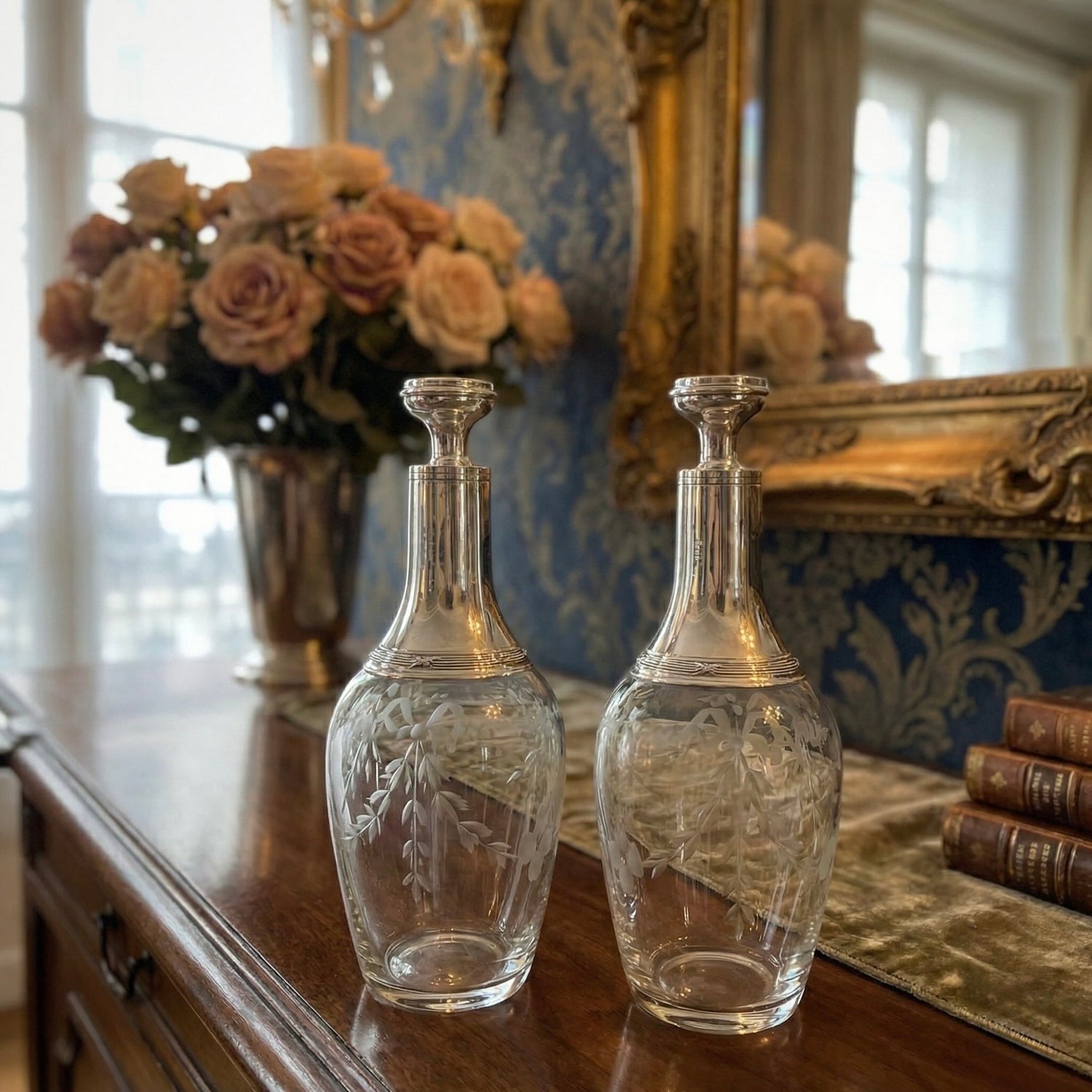Pair of French antique silver and crystal carafes with an elegant ribbon motif, adding sophistication and charm to any table setting.