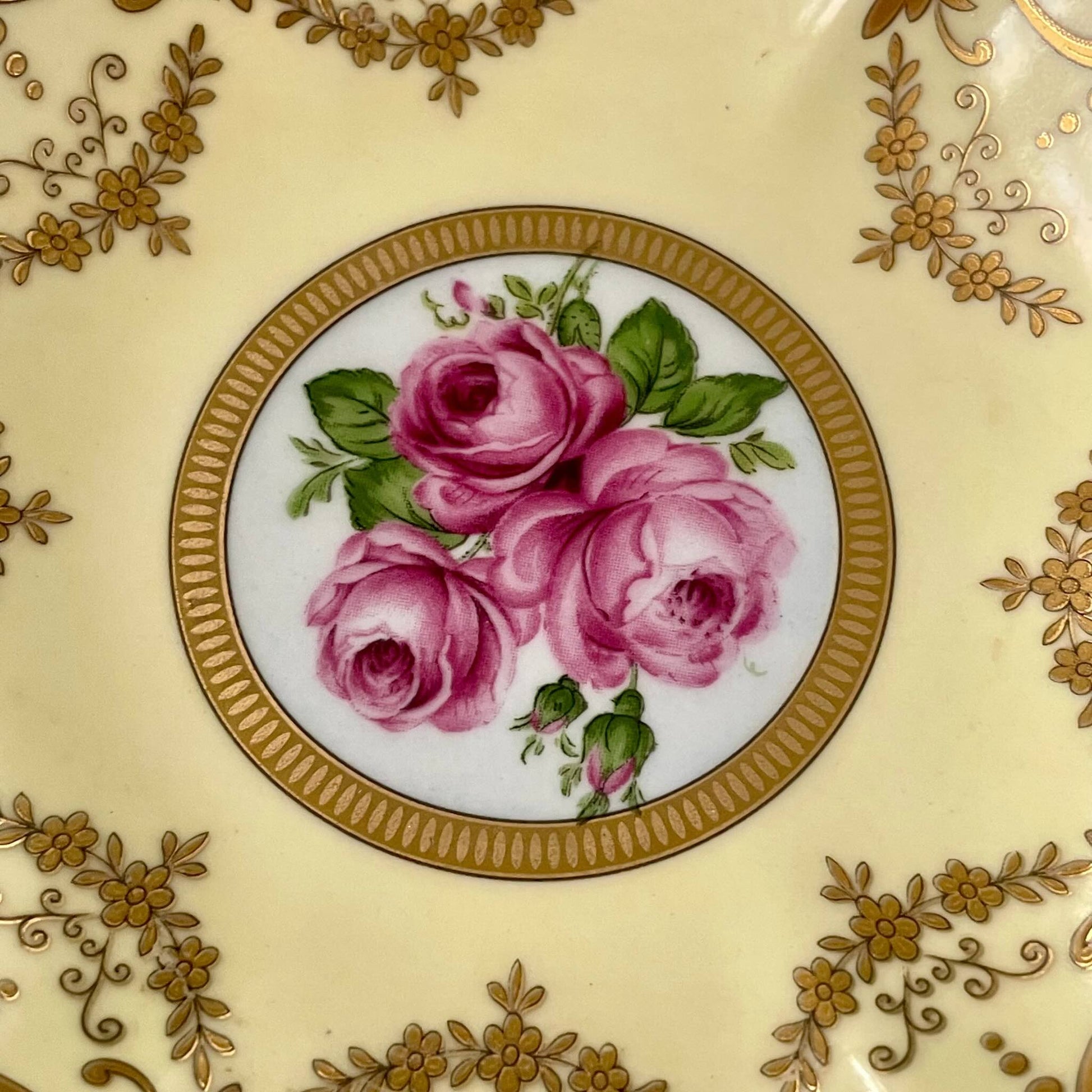 Porcelain trinket tray inspired by 18th-century Sèvres, featuring delicate roses and a golden garland, adding elegance to any room.