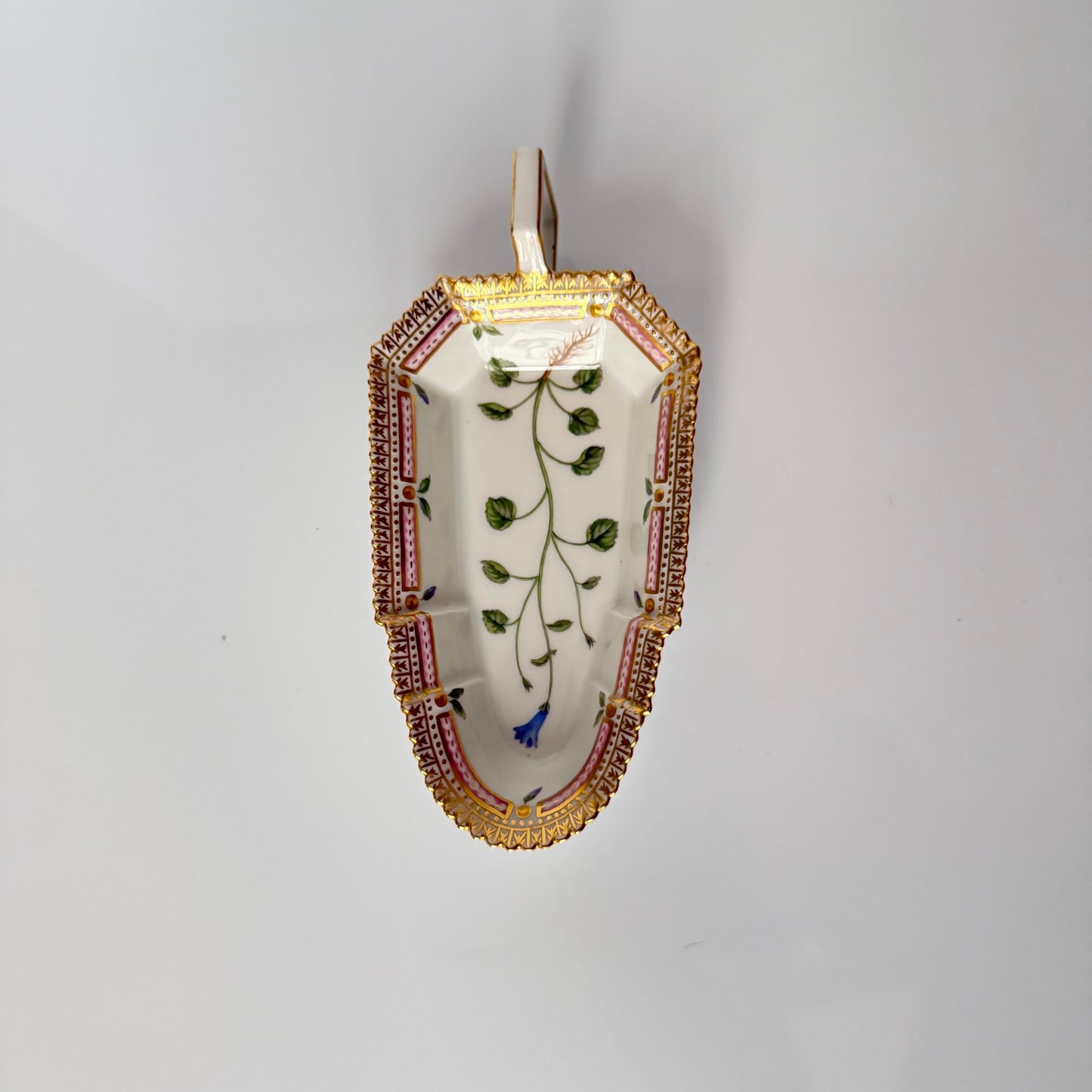 Royal Copenhagen “Flora Danica” small oblong hand-painted porcelain dish, Denmark 1967, decorated with intricate botanical illustrations inspired by 18th-century Danish scientific projects.