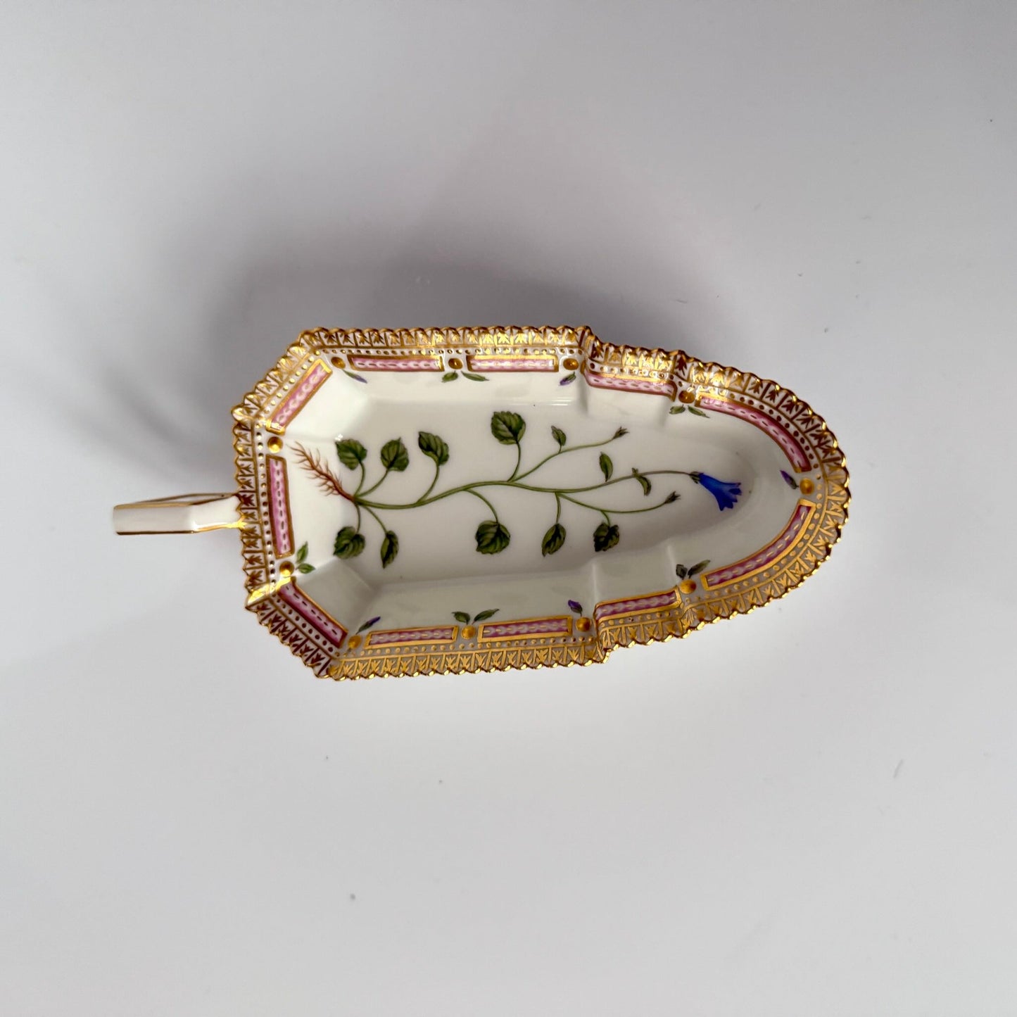 Royal Copenhagen “Flora Danica” small oblong hand-painted porcelain dish, Denmark 1967, decorated with intricate botanical illustrations inspired by 18th-century Danish scientific projects.