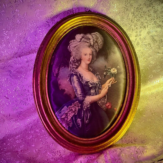 Silk print portrait of Marie Antoinette, inspired by Élisabeth Louise Vigée Le Brun's famous painting, with a rose in hand, framed in gilded wood.