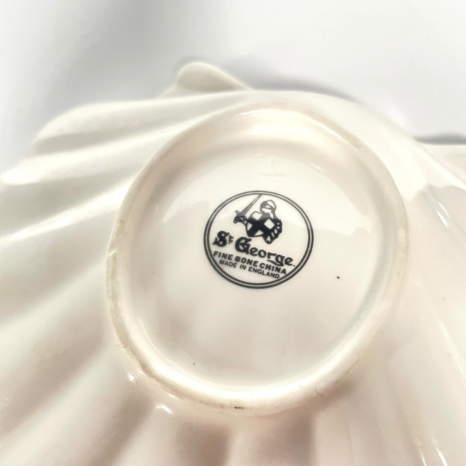 St George porcelain trinket tray with pink shell motif, ribbons, and floral accents. Perfect for small items or display.