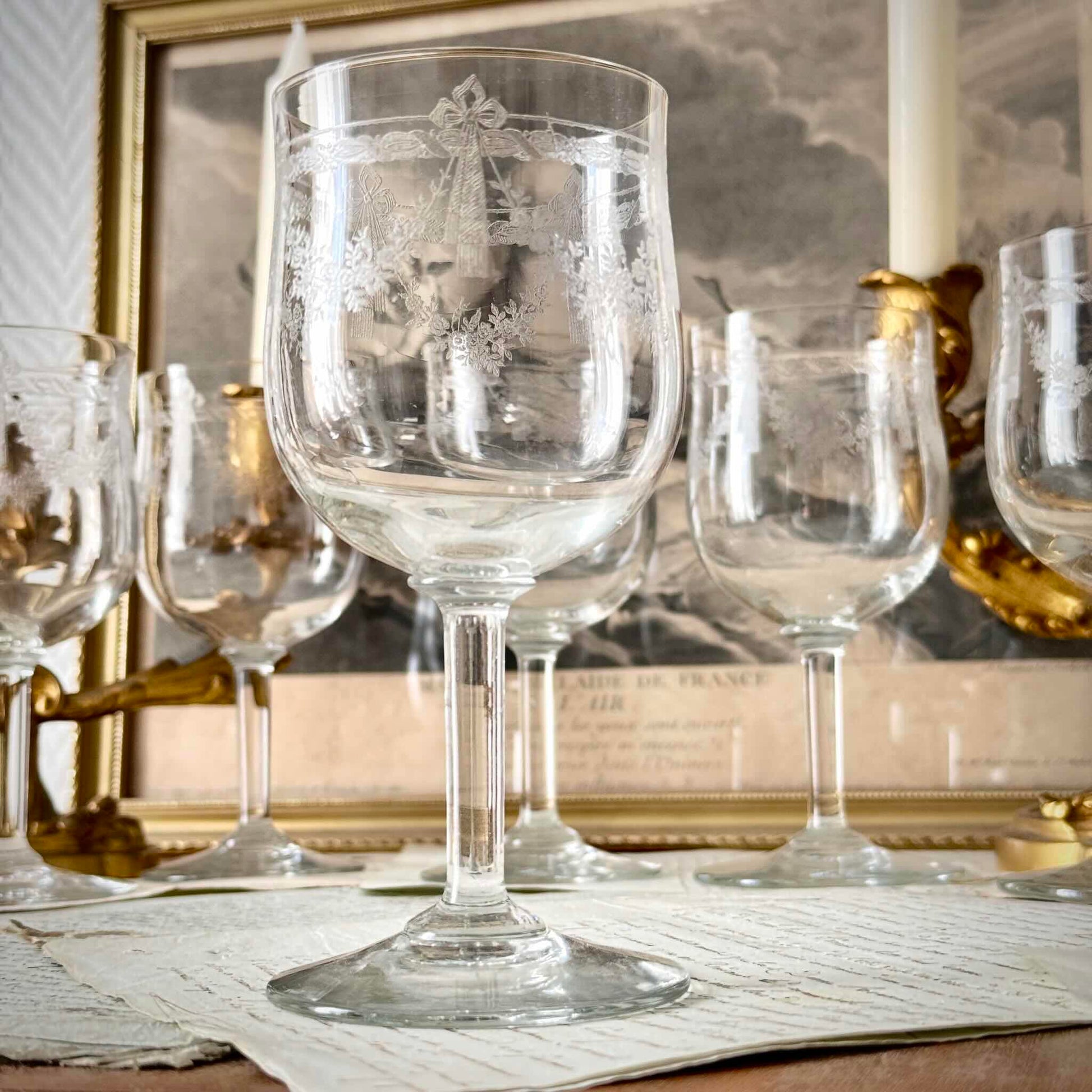 Vintage French acid-etched stemmed glass decorated with ribbon motifs and rose garlands, 20th century.
