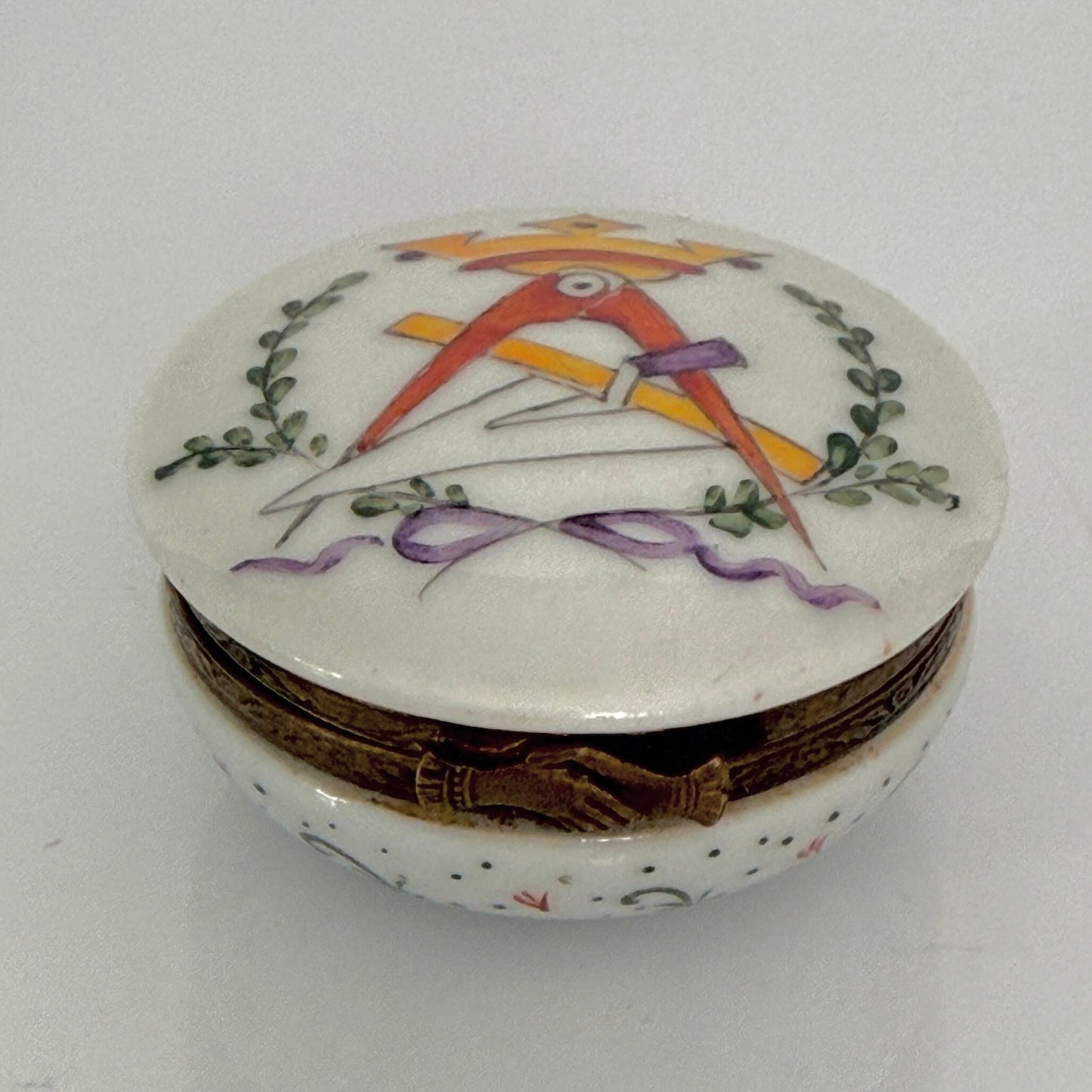 Vintage French porcelain Masonic pillbox, hand-painted Square and Compasses, metal handshake clasp.