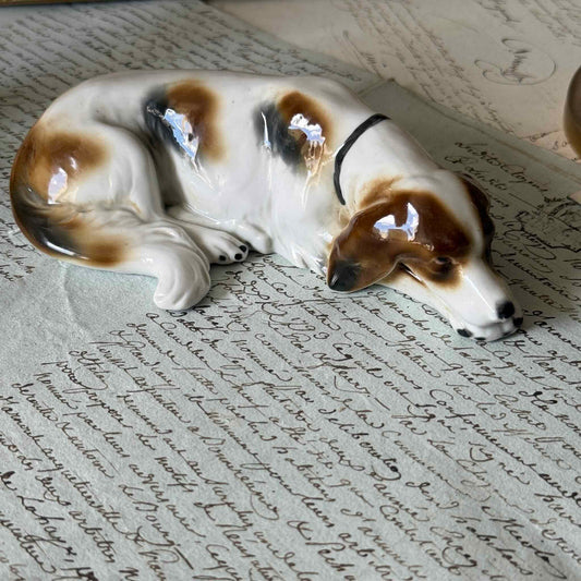 Vintage Goebel porcelain figurine of a sleeping hunting dog, hand-painted brown and white coat, circa 1935 Germany.