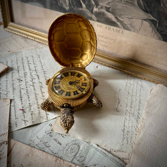 Vintage Lancel gilded bronze turtle-shaped alarm clock, carapace open revealing dial, circa 1950 France.