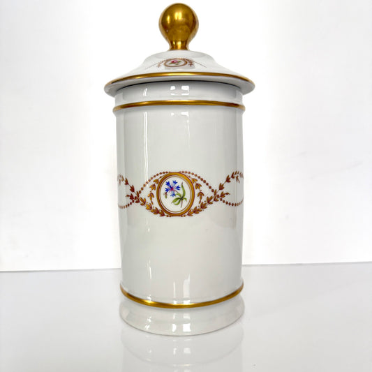 Vintage Limoges Castel porcelain apothecary jar with lid, decorated with floral medallions and gold scrolls, France.