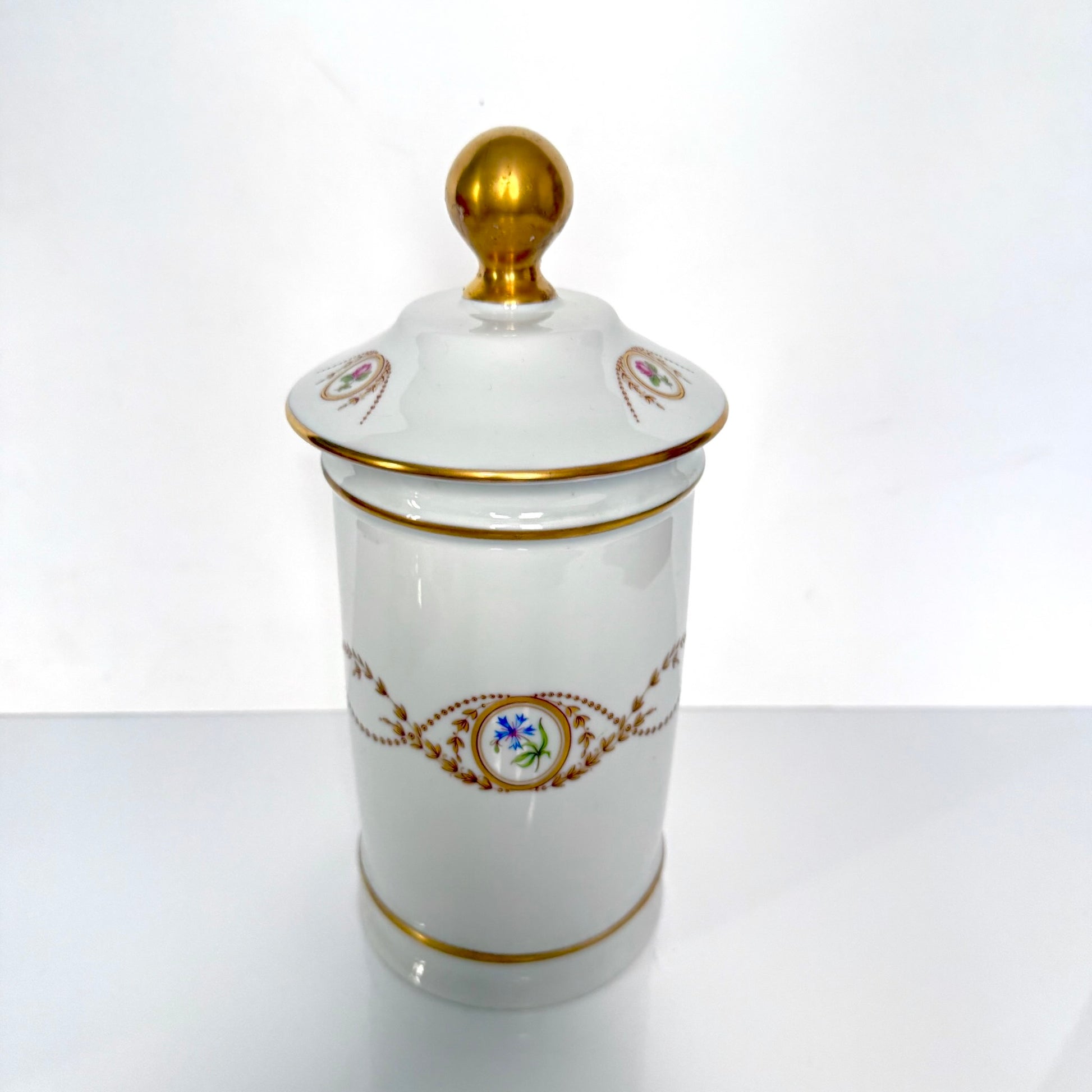 Vintage Limoges Castel porcelain apothecary jar with lid, decorated with floral medallions and gold scrolls, France.
