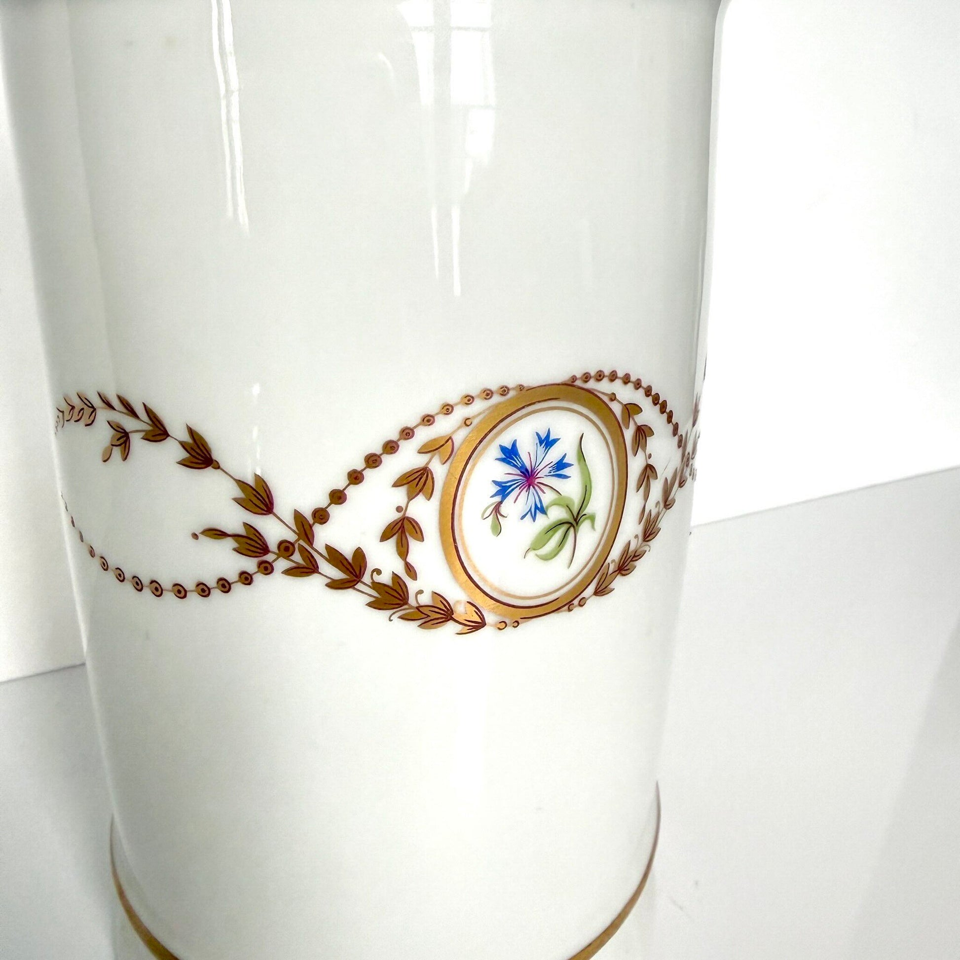 Vintage Limoges Castel porcelain apothecary jar with lid, decorated with floral medallions and gold scrolls, France.